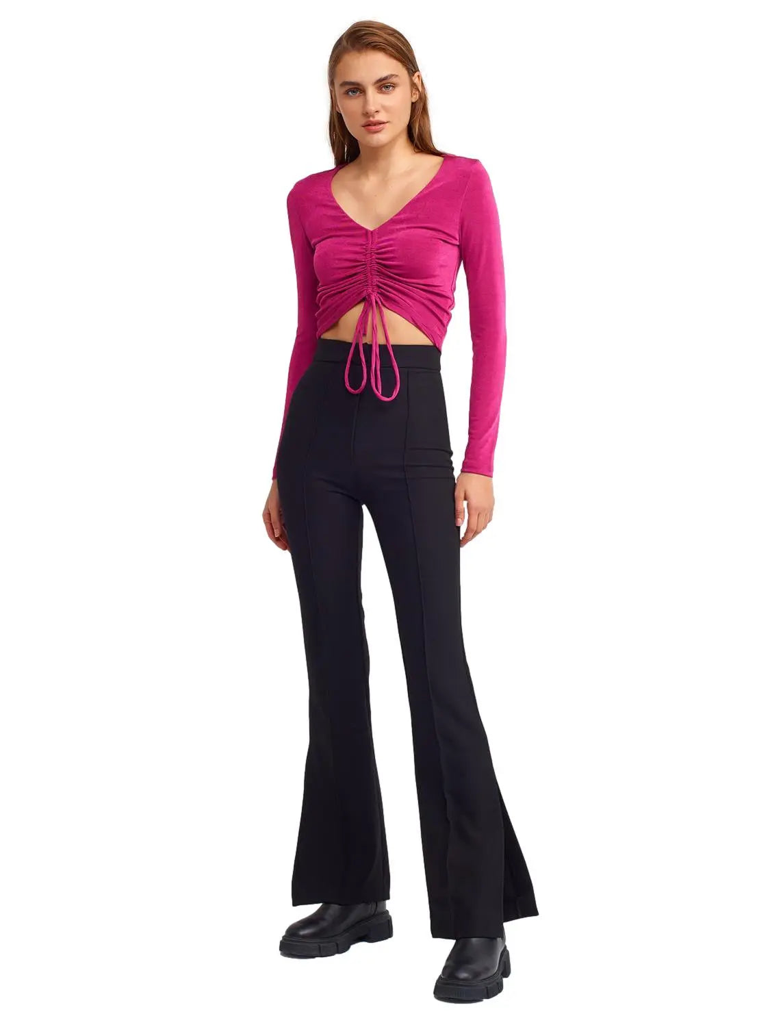 A pair of stylish flared trousers with slits on the sides, made from a comfortable blend of polyester, viscose, and elastane, displayed on a mannequin.