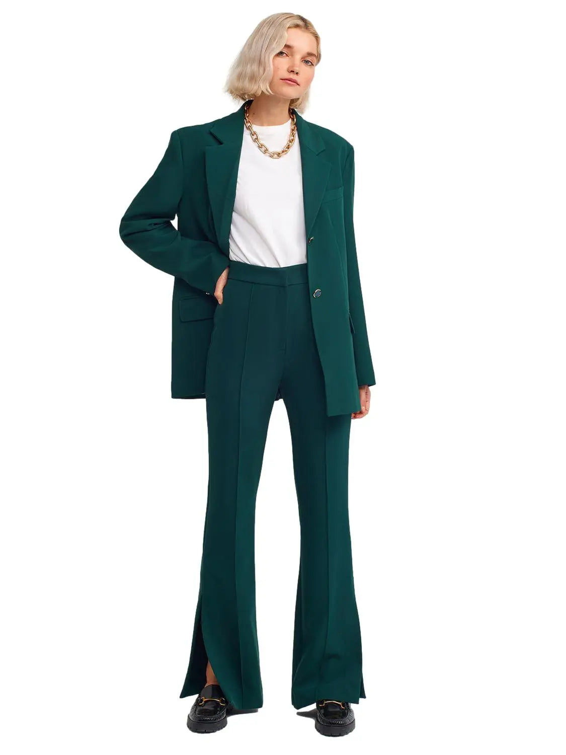 A pair of stylish flared trousers with slits on the sides, made from a comfortable blend of polyester, viscose, and elastane, displayed on a mannequin.