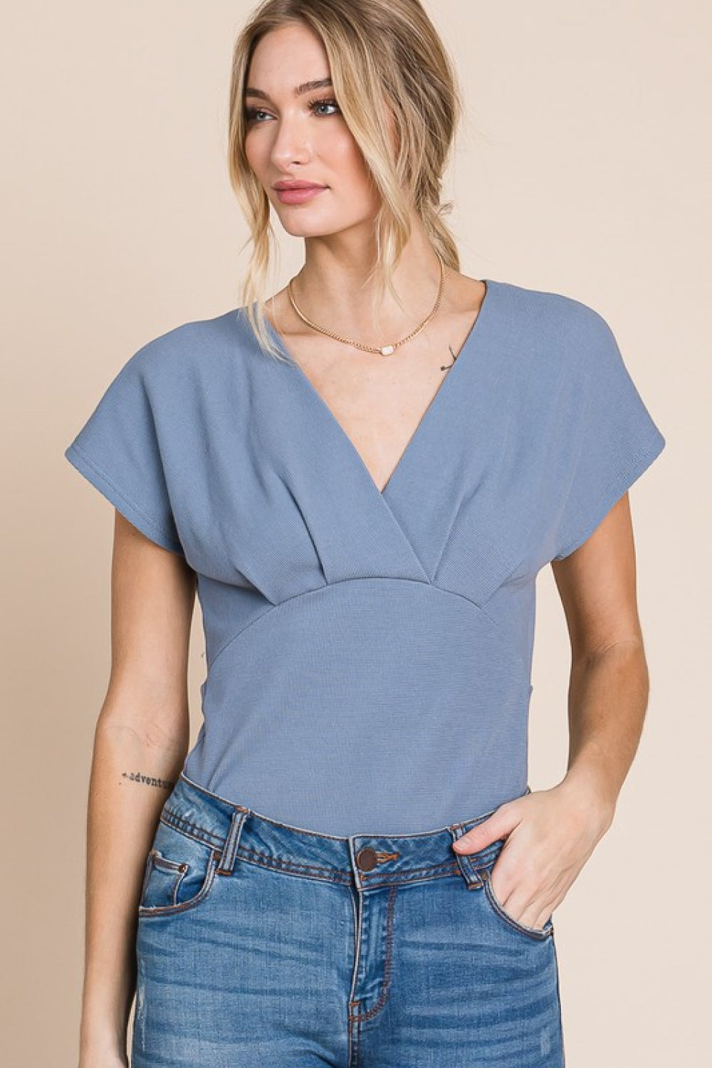 Flatter Me Thermal V-Neck Bodysuit featuring a plunge neckline and short sleeves, designed for a flattering fit and stylish look.