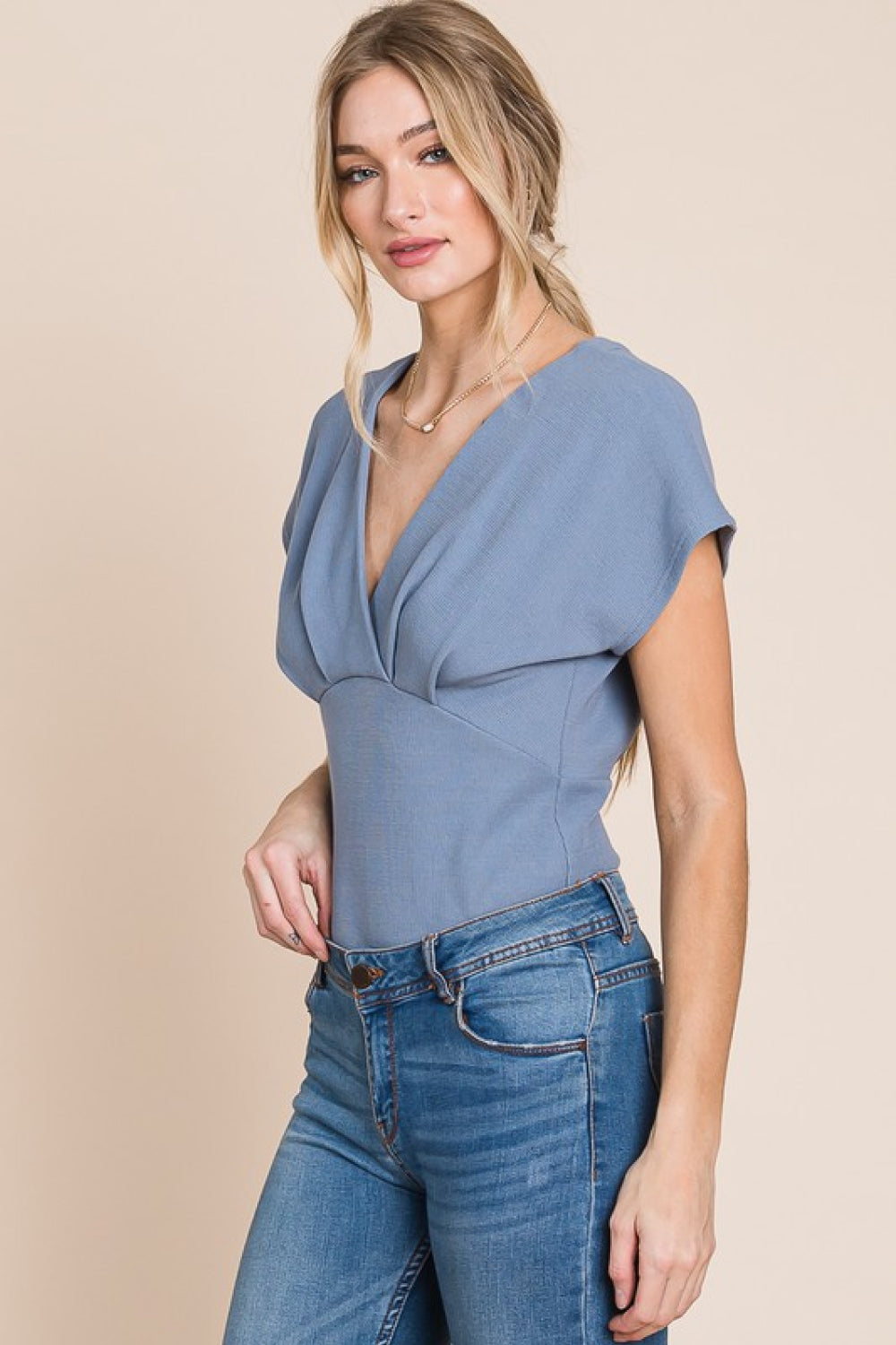 Flatter Me Thermal V-Neck Bodysuit featuring a plunge neckline and short sleeves, designed for a flattering fit and stylish look.