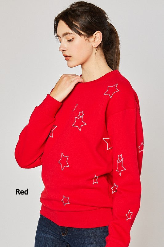 Fleece Basic Sweatshirt with Star Emb featuring an all-over star print in red, black, or white with grey outlines.