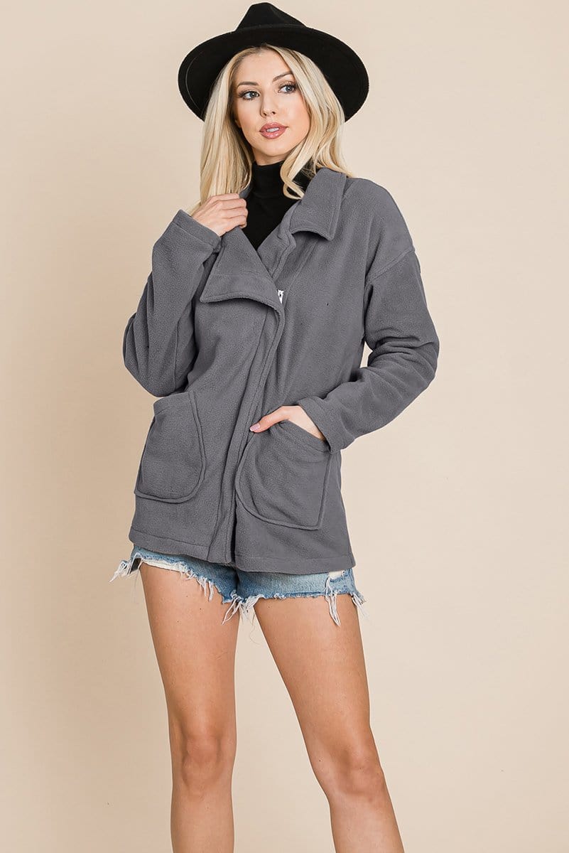 Lightweight fleece jacket with lapel collar and front zipper, featuring two pockets and soft sherpa fabric, perfect for chilly days.