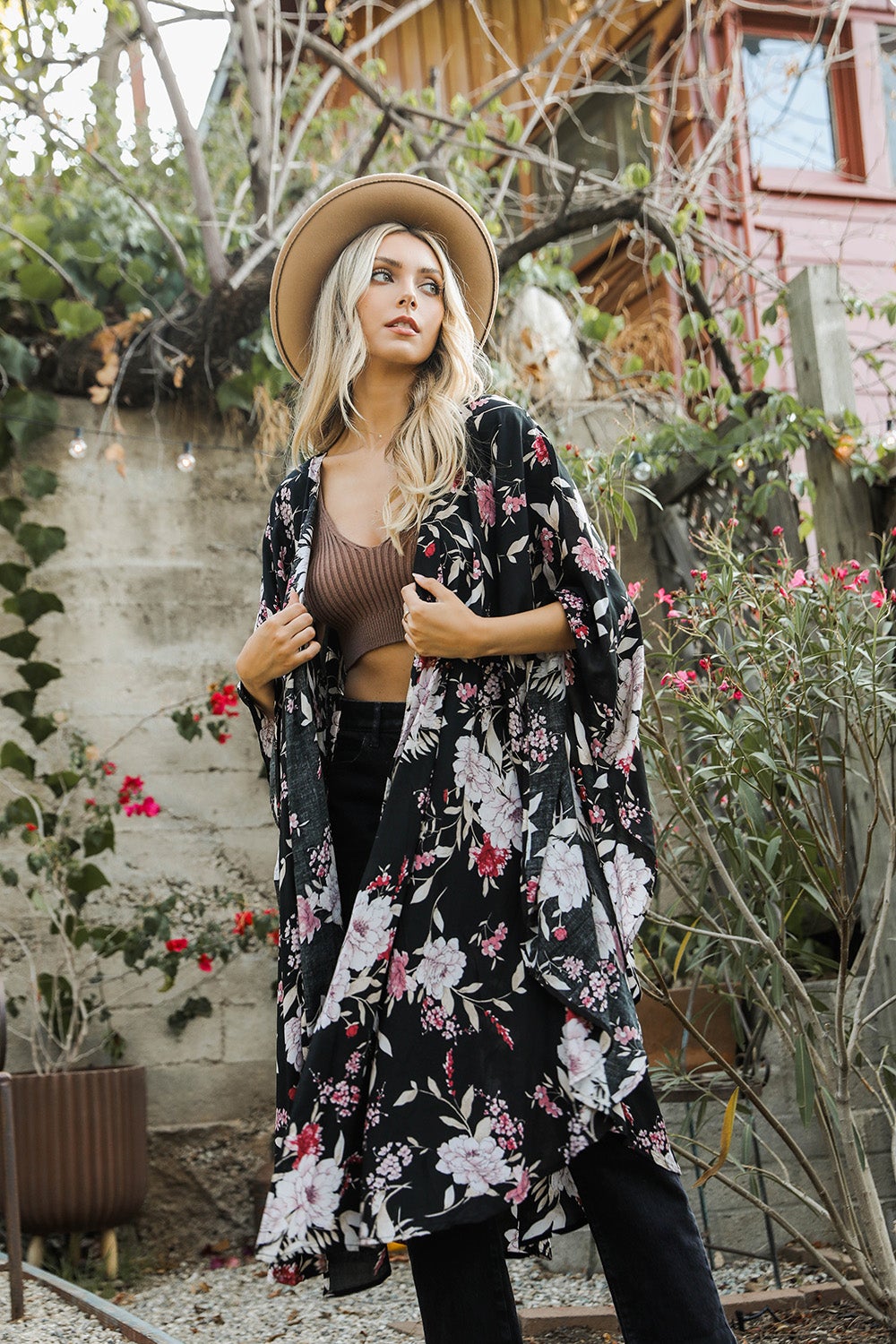 A stylish Floral Butterfly Sleeve Kimono featuring a vibrant floral pattern, showcasing butterfly sleeves and lightweight fabric, perfect for any occasion.