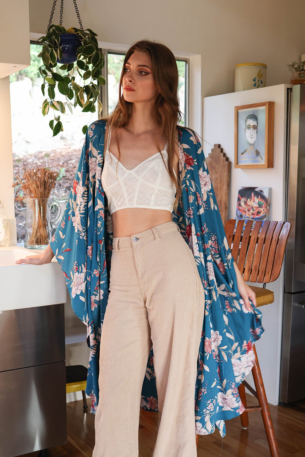 A stylish Floral Butterfly Sleeve Kimono featuring a vibrant floral pattern, showcasing butterfly sleeves and lightweight fabric, perfect for any occasion.