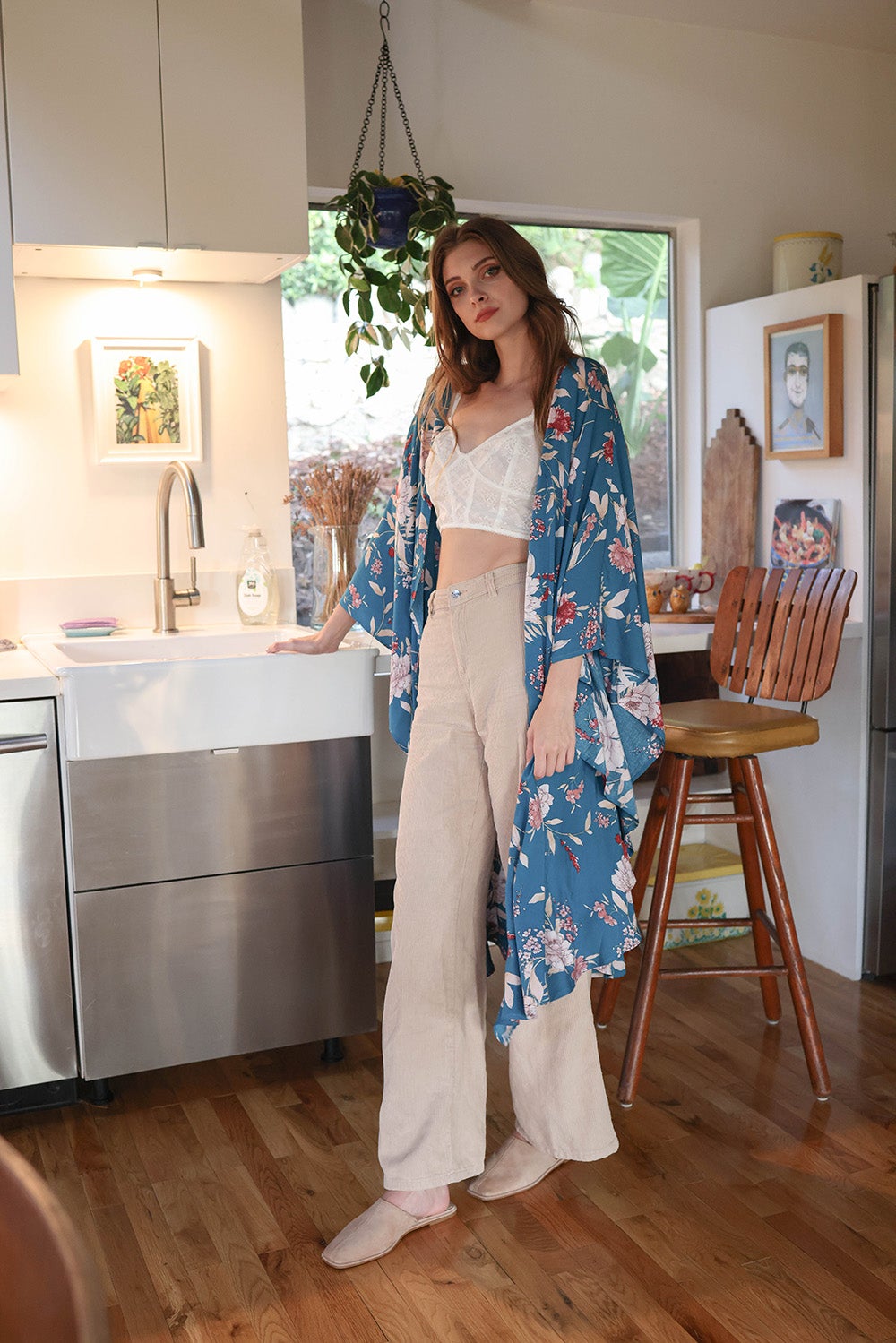 A stylish Floral Butterfly Sleeve Kimono featuring a vibrant floral pattern, showcasing butterfly sleeves and lightweight fabric, perfect for any occasion.