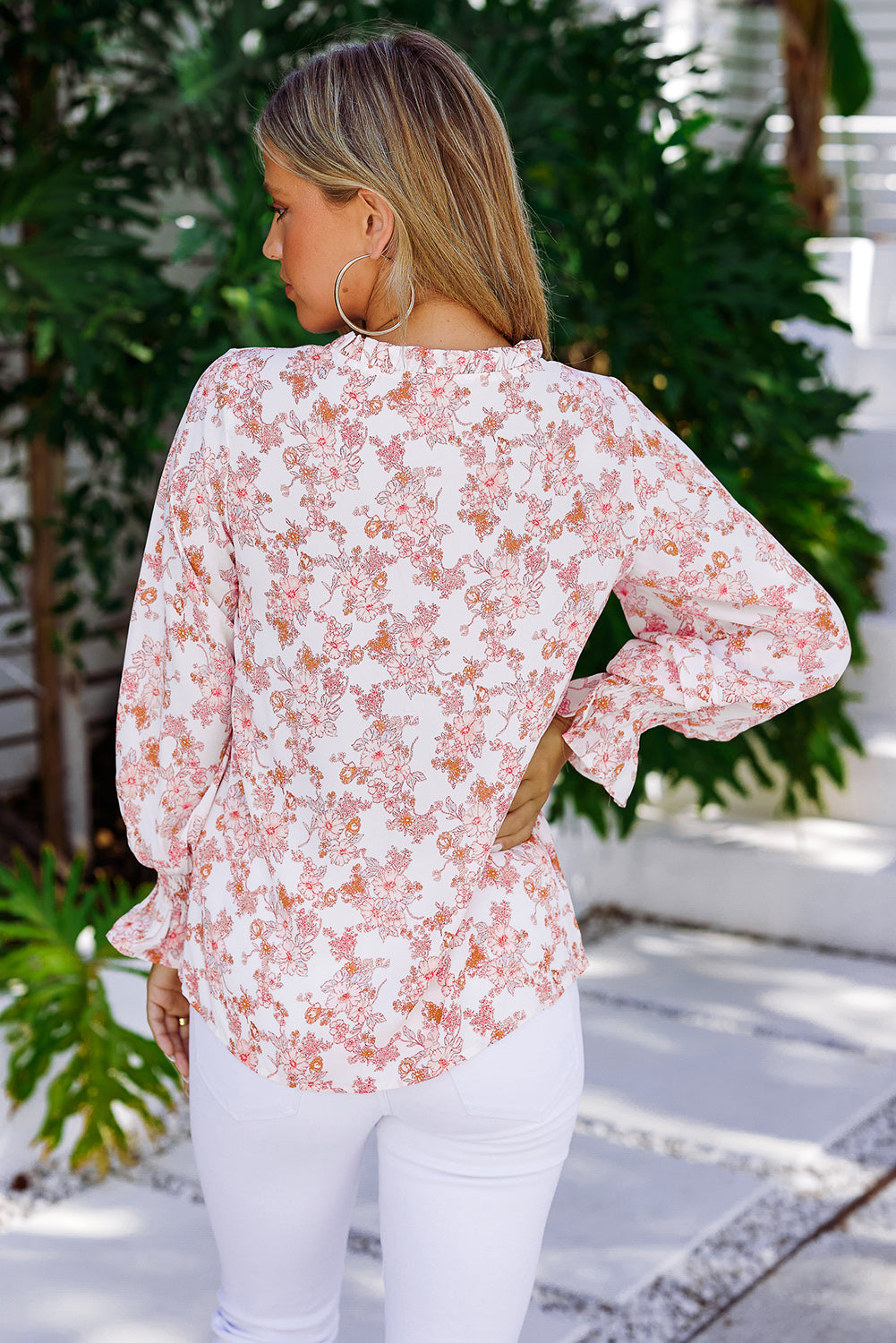 A stylish Floral Frill Trim Tie Neck Flounce Sleeve Blouse featuring a vibrant floral pattern, flounce sleeves, and a chic tie neck design.