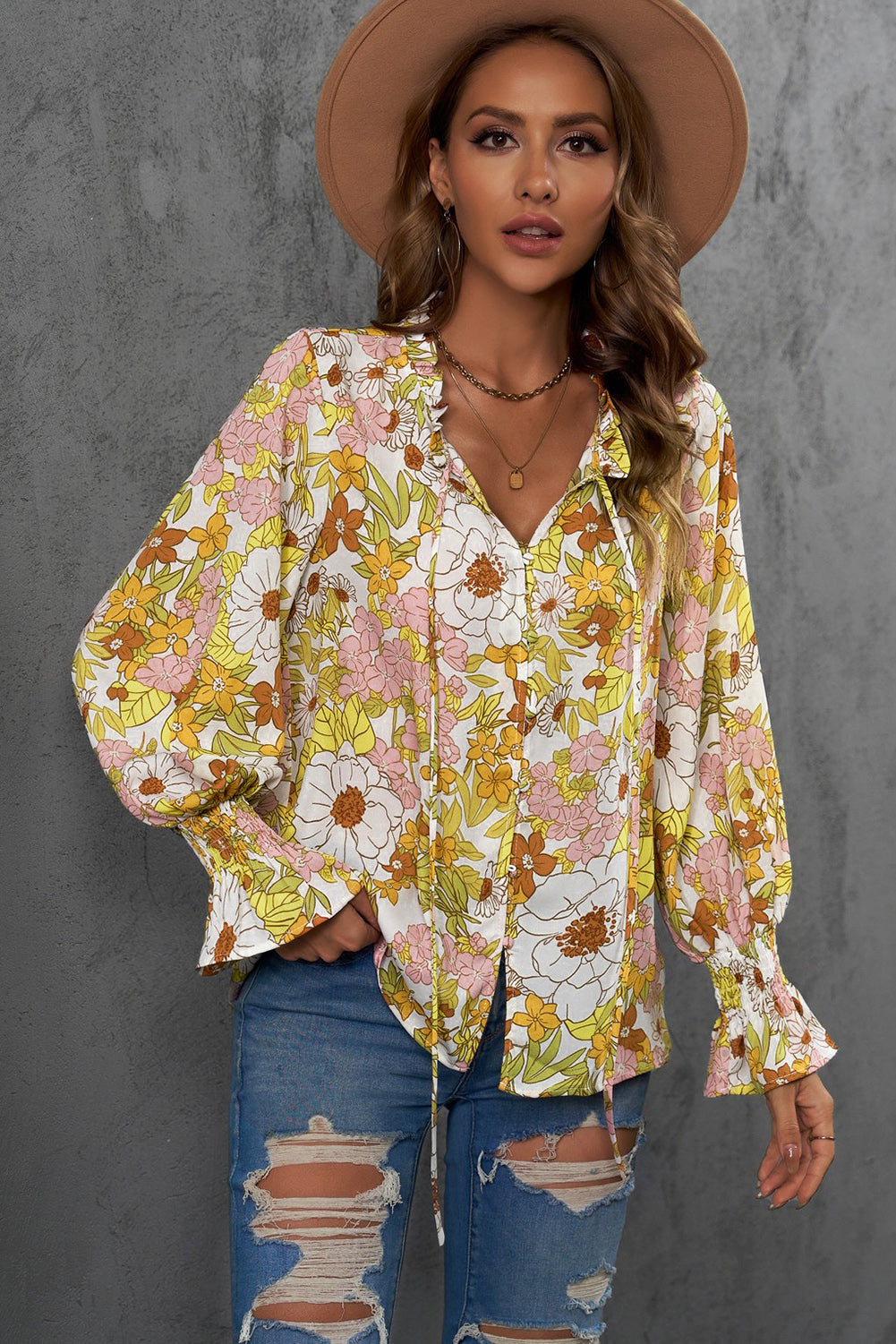 A stylish Floral Frill Trim Tie Neck Flounce Sleeve Blouse featuring a vibrant floral pattern, flounce sleeves, and a chic tie neck design.