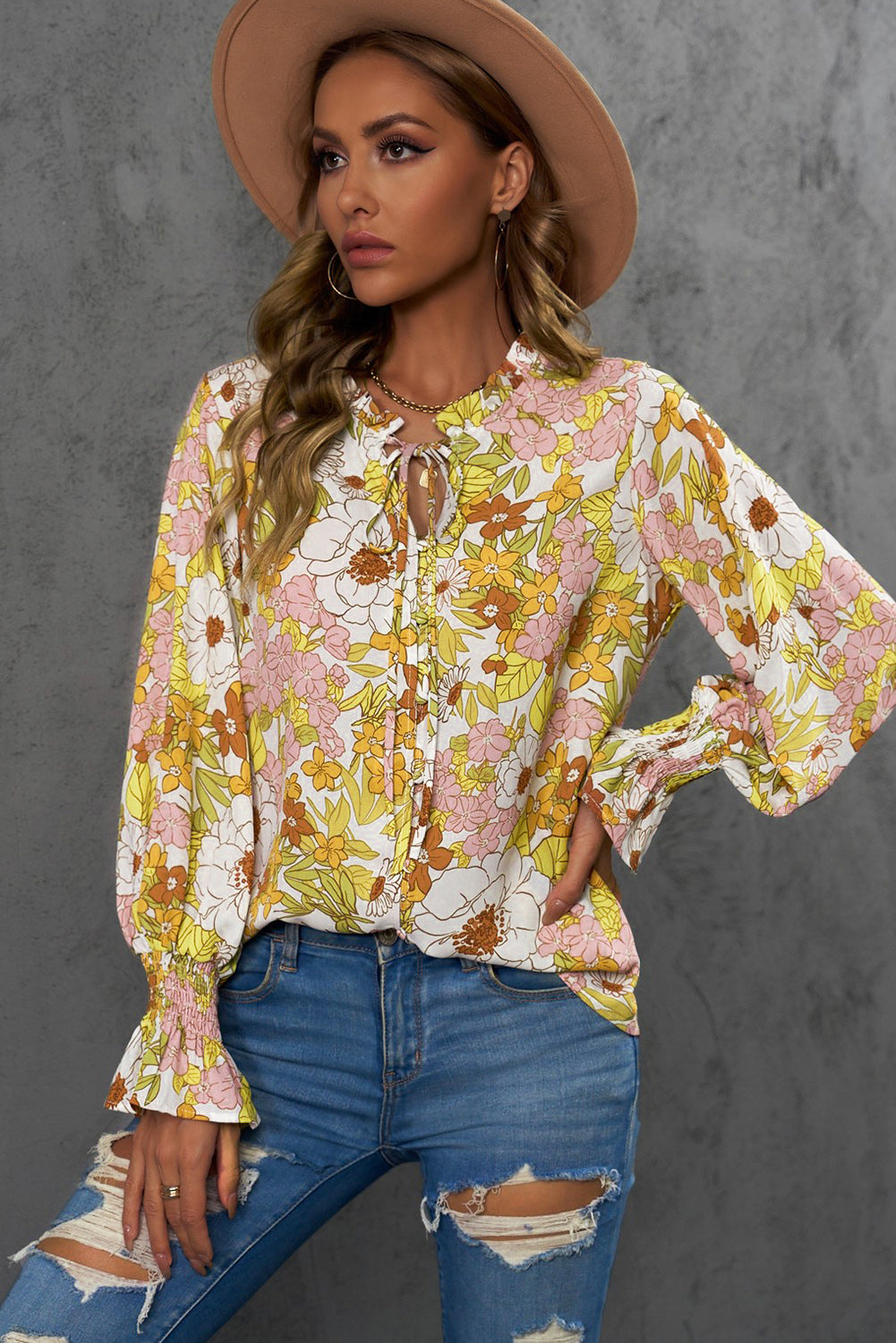 A stylish Floral Frill Trim Tie Neck Flounce Sleeve Blouse featuring a vibrant floral pattern, flounce sleeves, and a chic tie neck design.