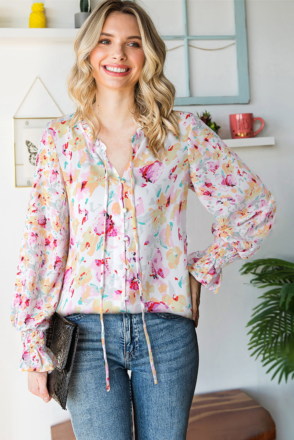 A stylish Floral Frill Trim Tie Neck Flounce Sleeve Blouse featuring a vibrant floral pattern, flounce sleeves, and a chic tie neck design.