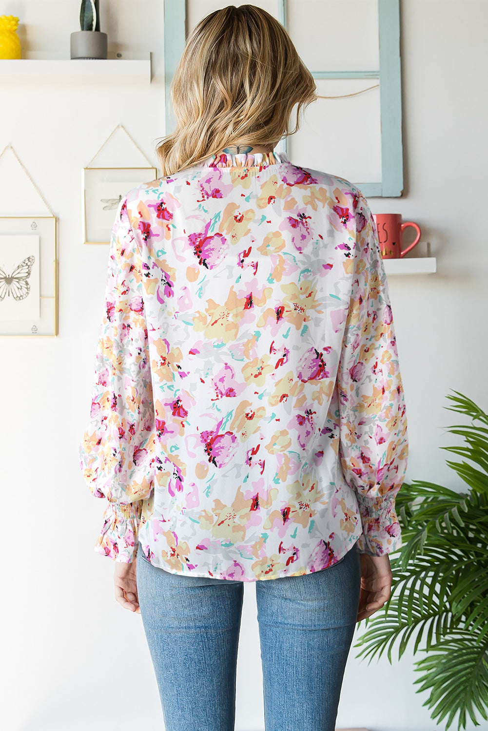 A stylish Floral Frill Trim Tie Neck Flounce Sleeve Blouse featuring a vibrant floral pattern, flounce sleeves, and a chic tie neck design.