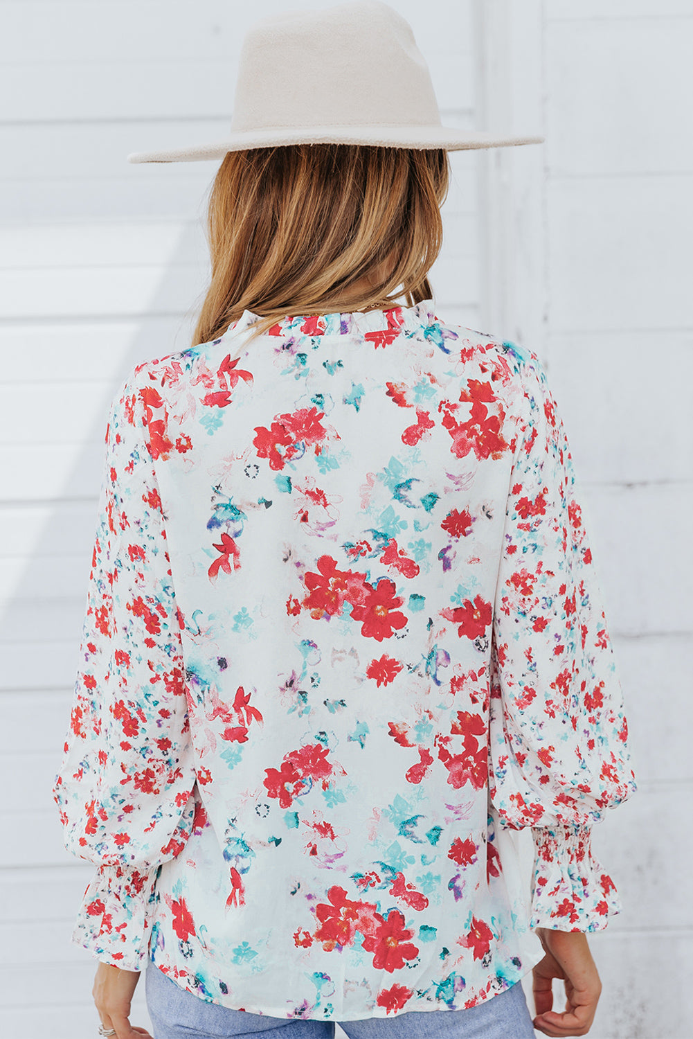 A stylish Floral Frill Trim Tie Neck Flounce Sleeve Blouse featuring a vibrant floral pattern, flounce sleeves, and a chic tie neck design.