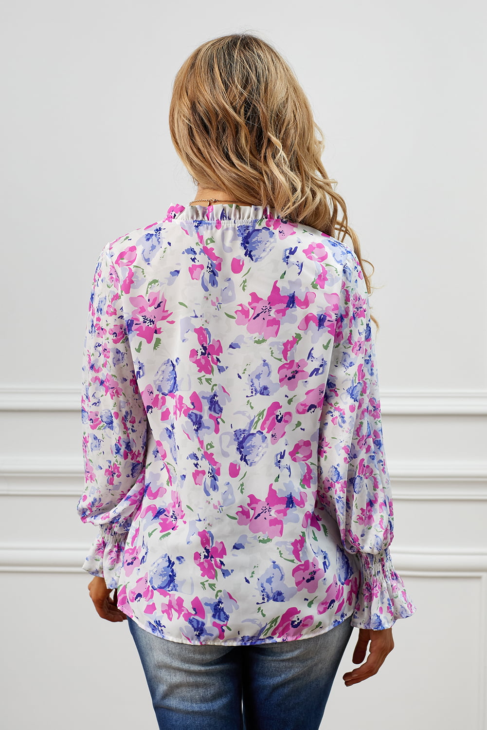 A stylish Floral Frill Trim Tie Neck Flounce Sleeve Blouse featuring a vibrant floral pattern, flounce sleeves, and a chic tie neck design.