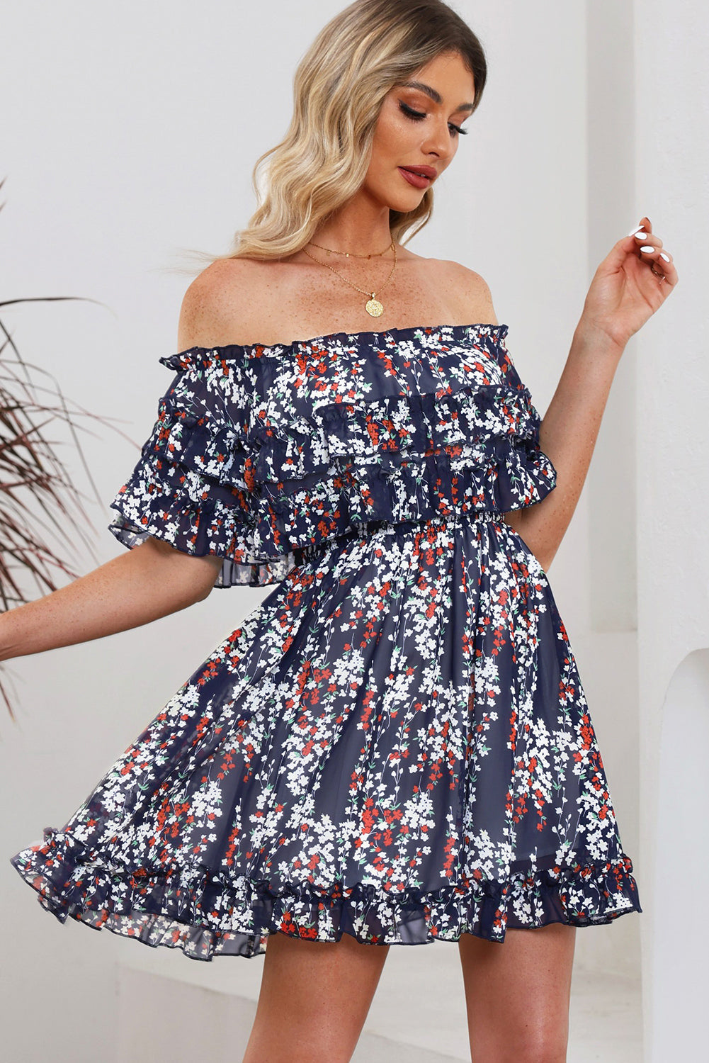 A stylish floral off-shoulder dress with ruffle hem, showcasing a chic design perfect for summer outings.