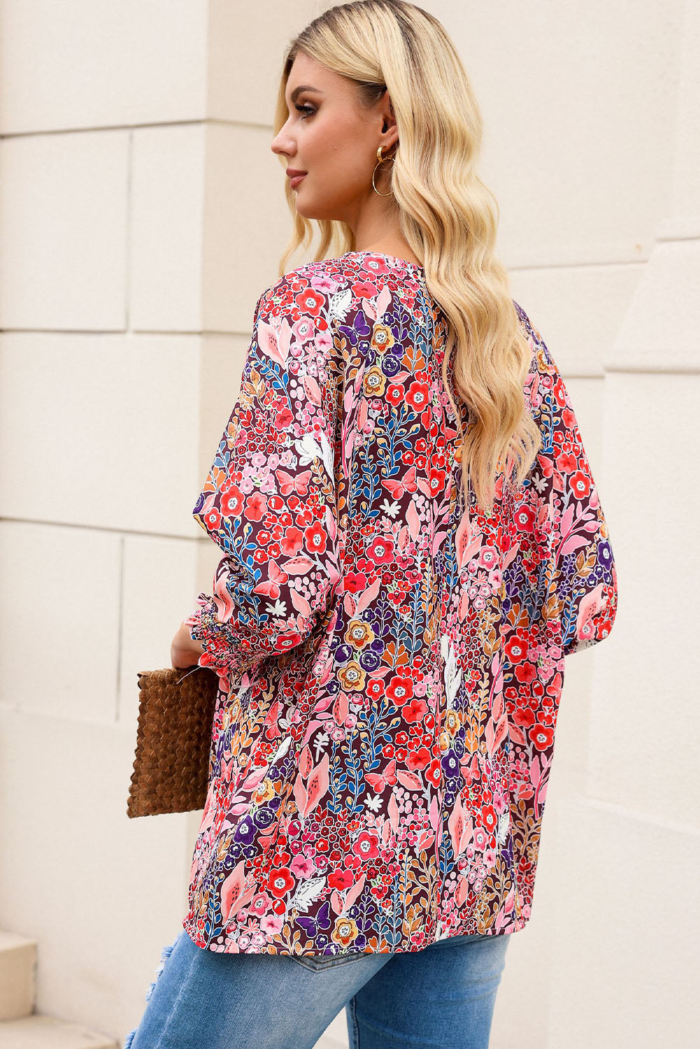 A stylish Floral Print Shirred Tunic Blouse featuring a vibrant flower pattern, bateau neckline, and elegant shirred 3/4 sleeves, perfect for any occasion.