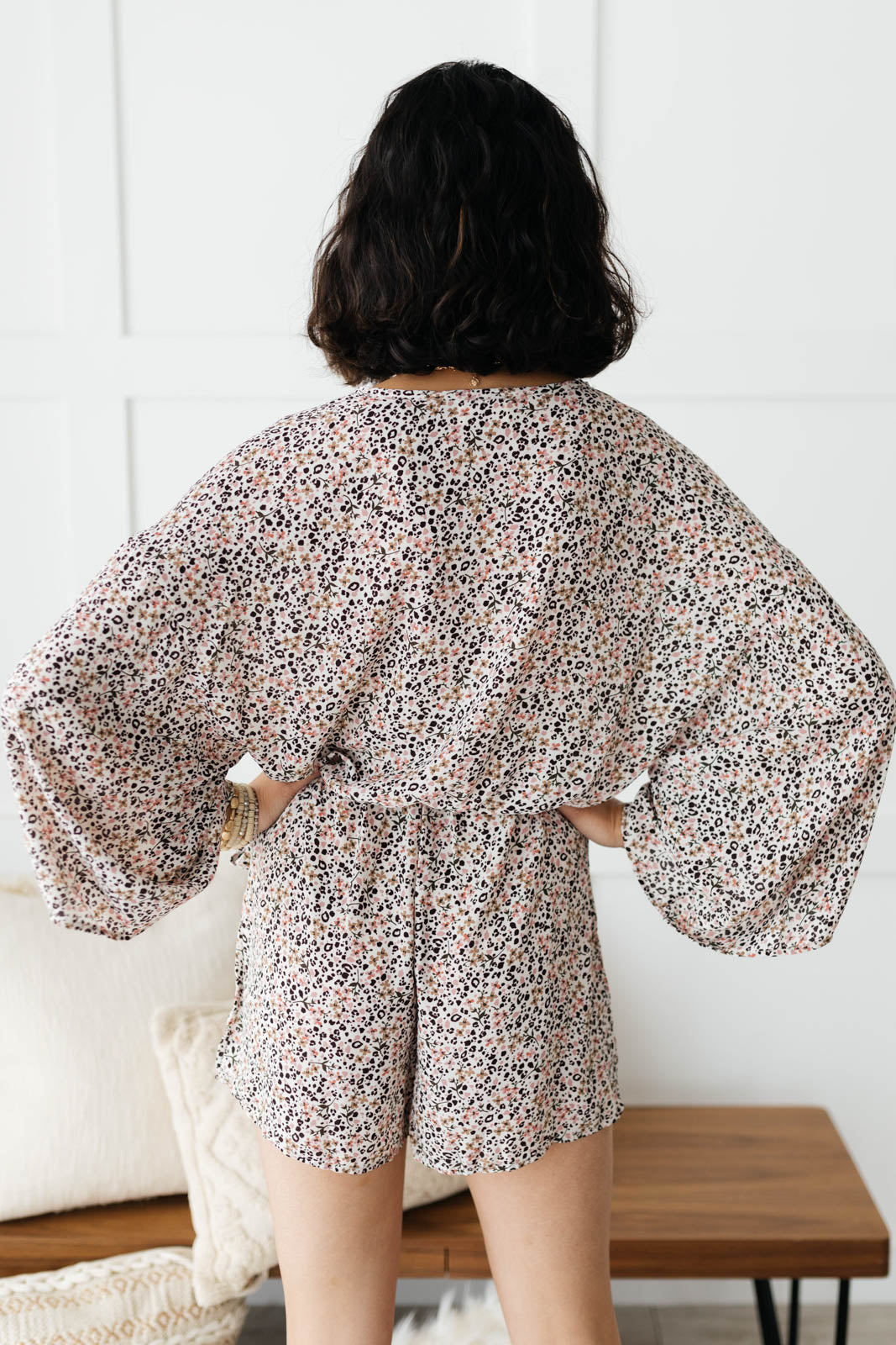 Floral To Love Romper featuring a floral and animal print design with bell sleeves and an elastic waist, perfect for stylish summer outings.