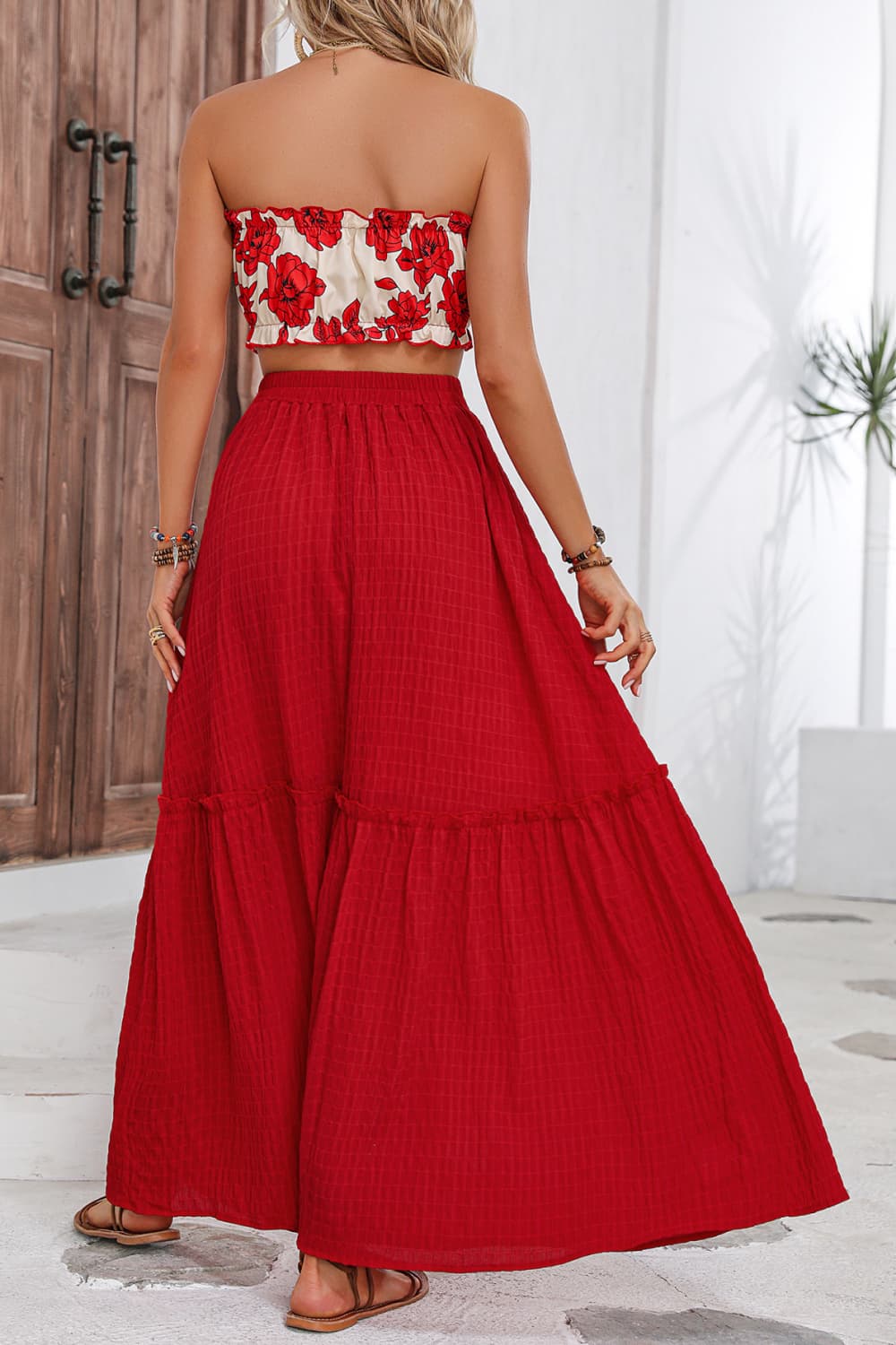 A stylish floral tube top and maxi skirt set featuring a chic design with frill details, perfect for summer outings.