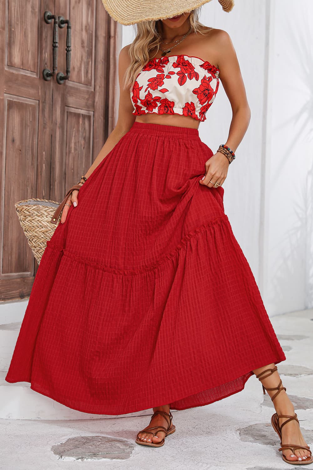 A stylish floral tube top and maxi skirt set featuring a chic design with frill details, perfect for summer outings.