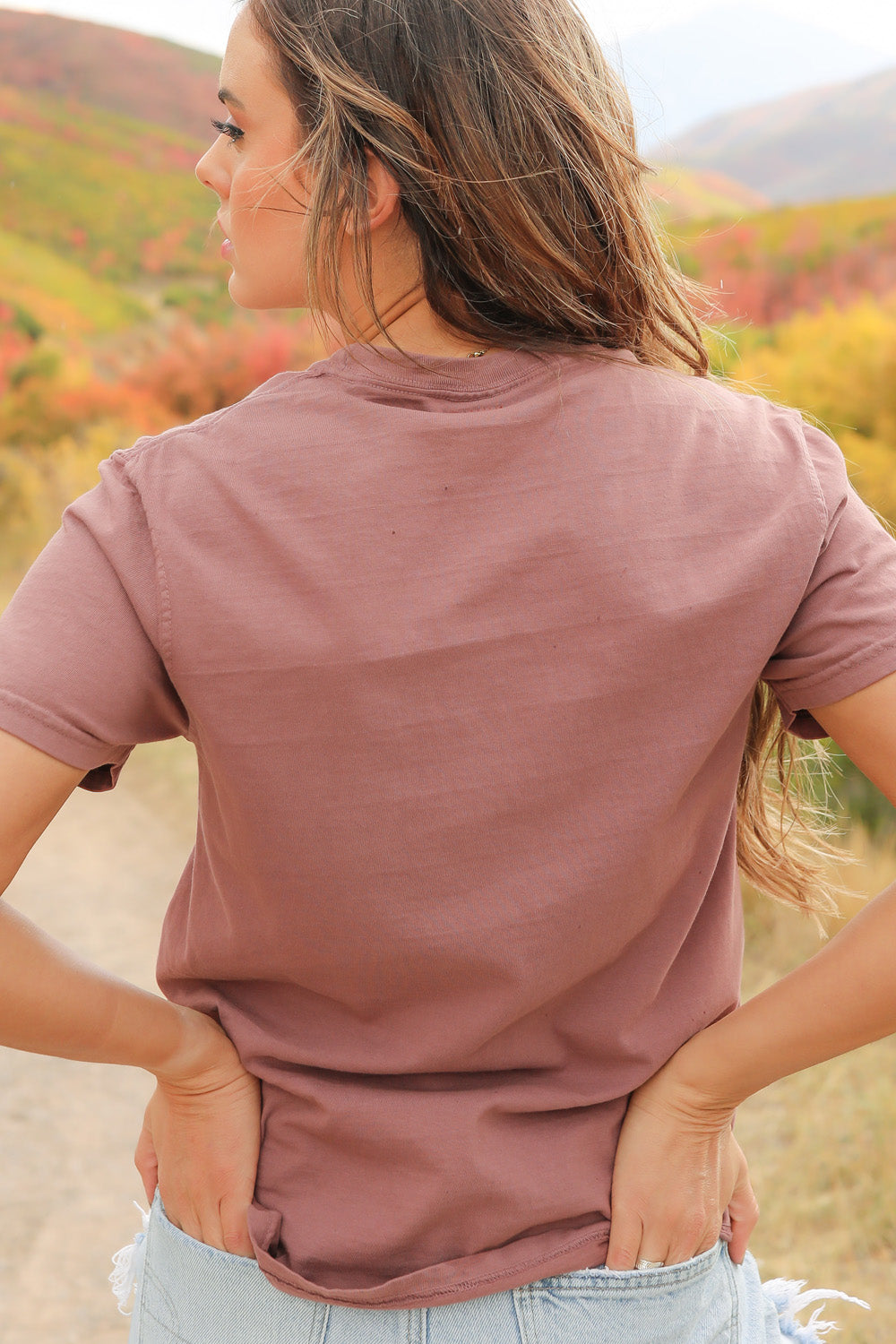 Flower Child shirt in pink, made from 100% upcycled cotton, showcasing a relaxed fit and ethical craftsmanship.