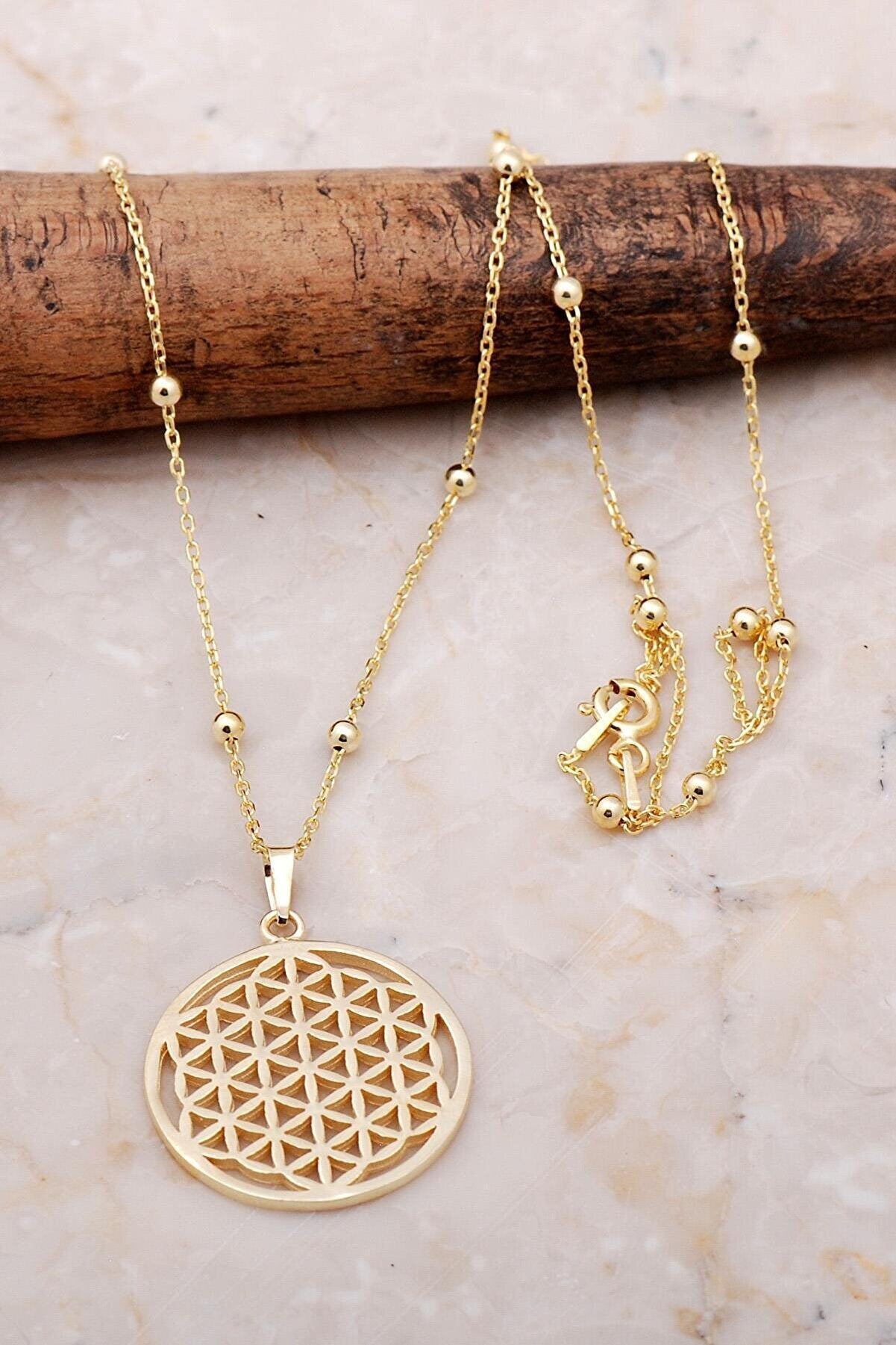 Flower of Life Gold Gilded Silver Necklace featuring intricate design and luxurious gold finish on sterling silver.