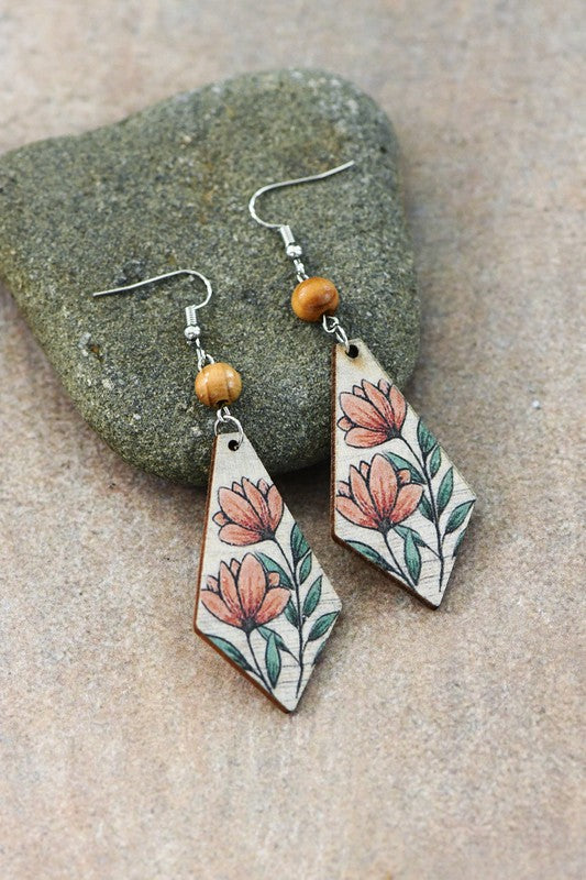 A pair of flower printed wood earrings featuring vibrant floral designs on lightweight wood, perfect for casual and stylish outfits.