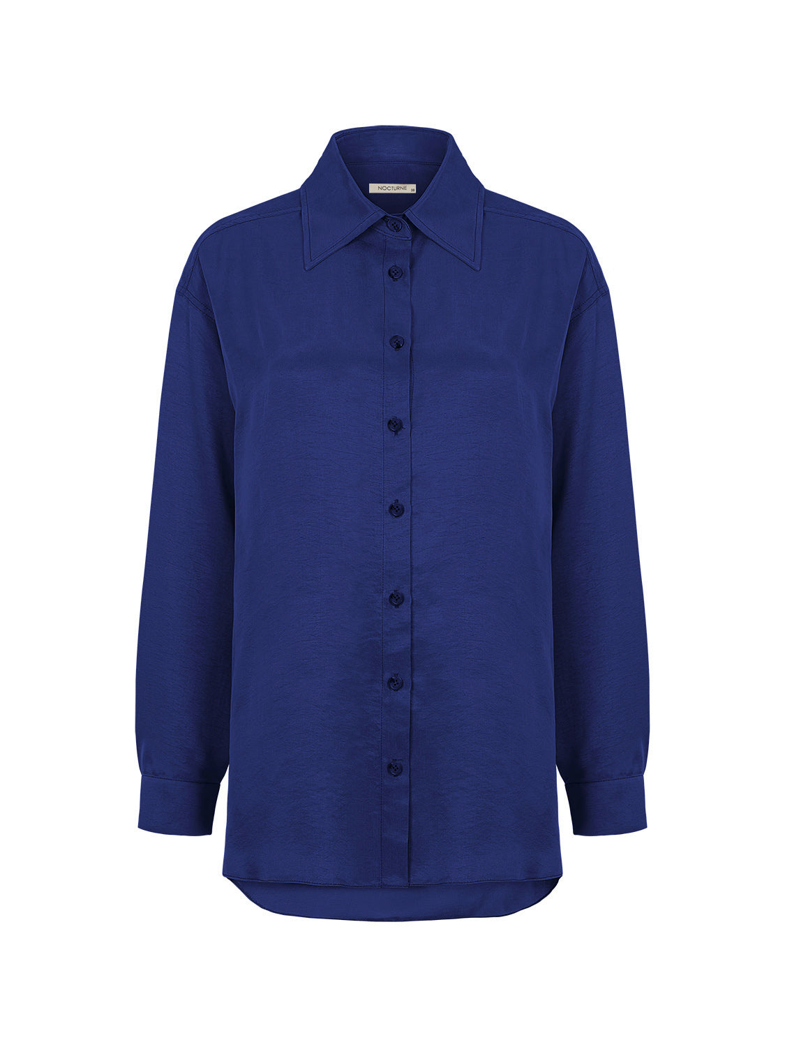 Flowy oversized shirt with lapel collar, front buttons, and long sleeves, featuring vibrant colors and a relaxed fit.