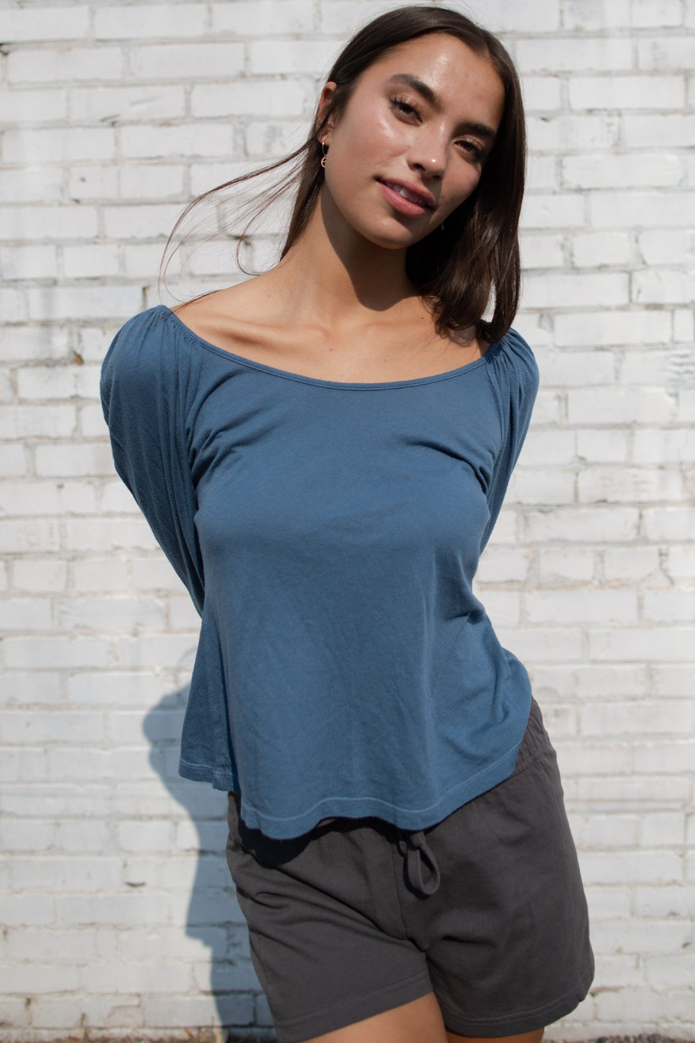 Flowy Tee in indigo and sky blue with puff shoulders and long sleeves, showcasing a scoop neck design.