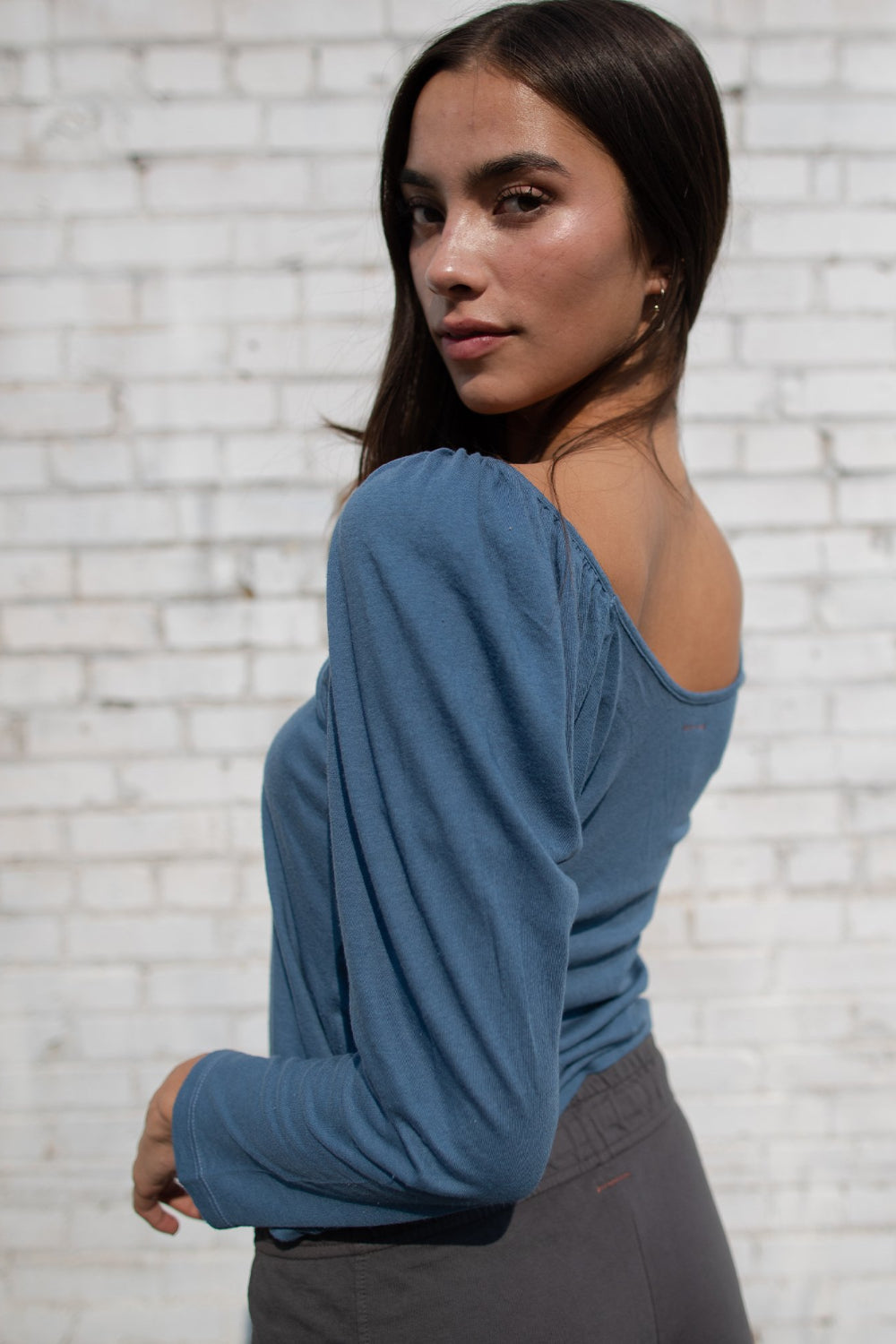 Flowy Tee in indigo and sky blue with puff shoulders and long sleeves, showcasing a scoop neck design.