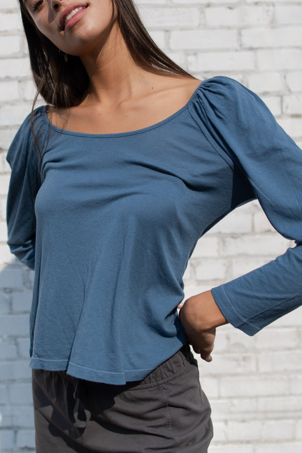 Flowy Tee in indigo and sky blue with puff shoulders and long sleeves, showcasing a scoop neck design.