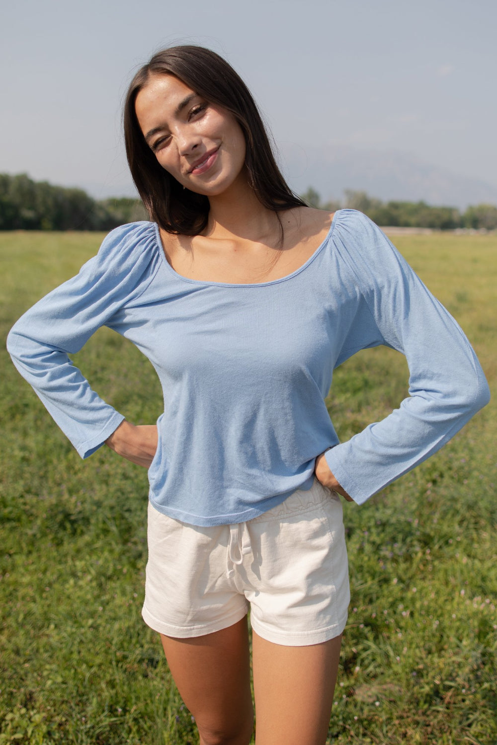 Flowy Tee in indigo and sky blue with puff shoulders and long sleeves, showcasing a scoop neck design.