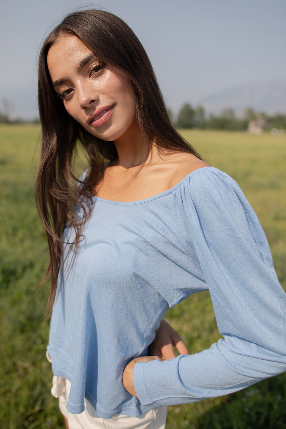 Flowy Tee in indigo and sky blue with puff shoulders and long sleeves, showcasing a scoop neck design.