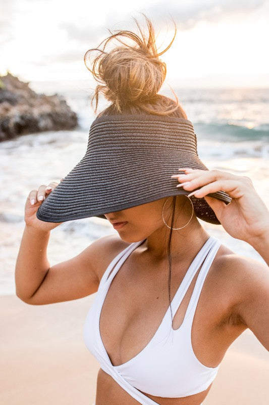 Foldable Wide Brim Bow Visor made of breathable straw with a stylish bow detail at the back.