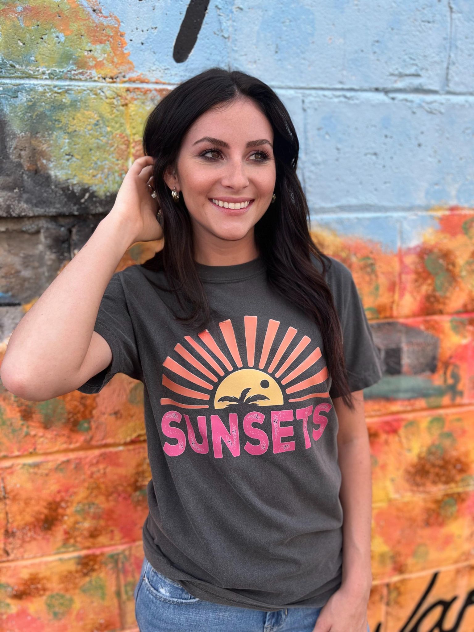 A stylish Forever Chasing Sunsets Tee in Pepper color, made from 100% cotton with a vibrant DTF printed design.