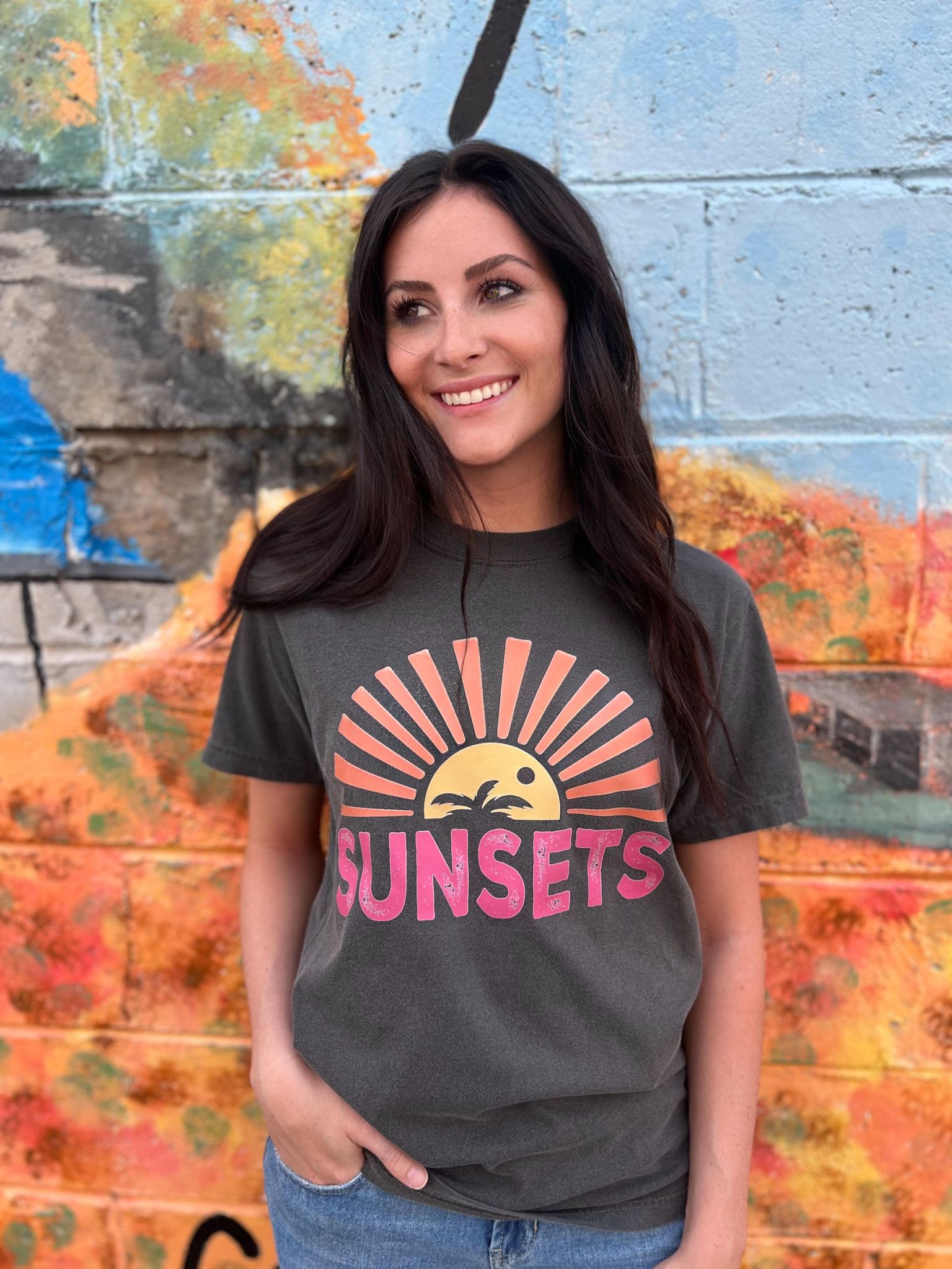 A stylish Forever Chasing Sunsets Tee in Pepper color, made from 100% cotton with a vibrant DTF printed design.