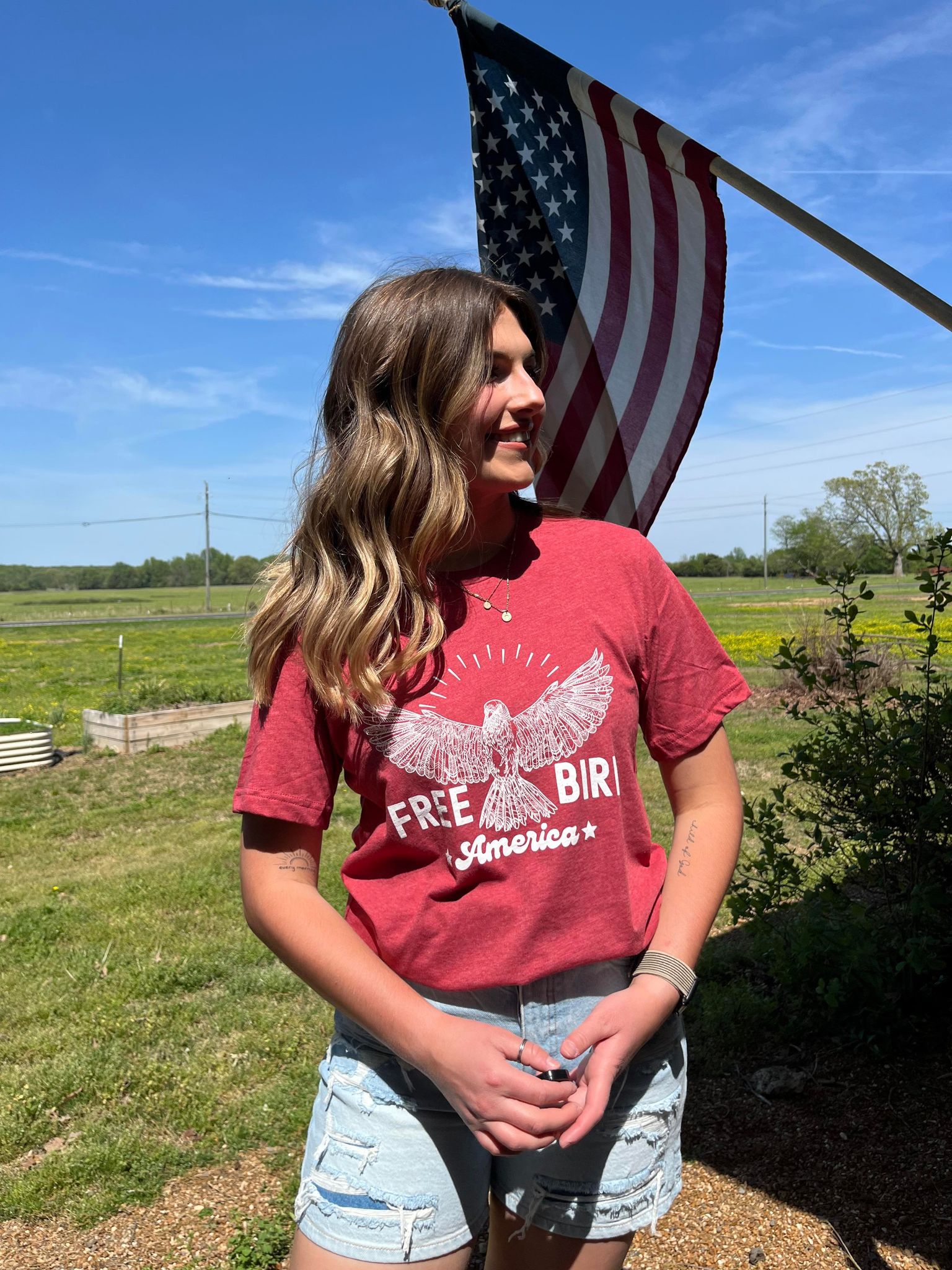 Free Bird: America graphic tee featuring a bird design, perfect for celebrating Independence Day.