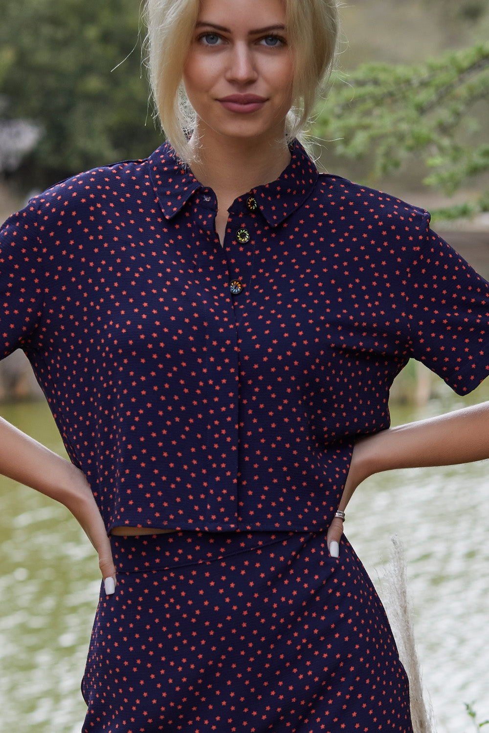 Freedom To Dance Mini Skirt featuring dark blue stars pattern, perfect for warm weather outings.