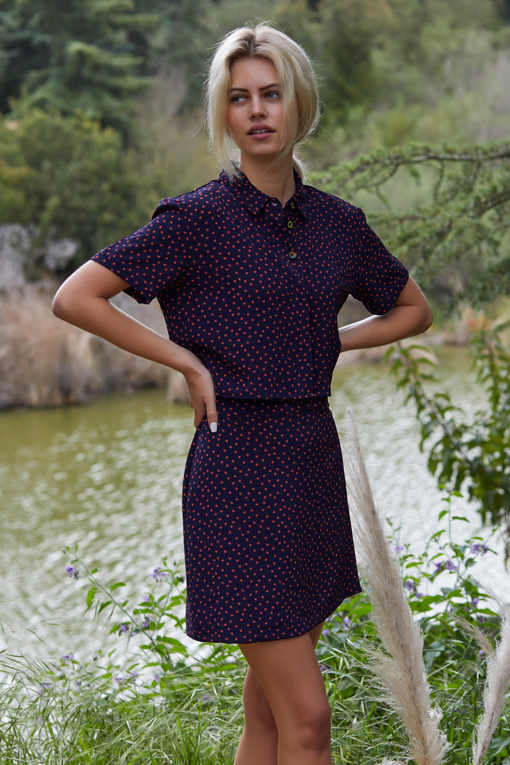 Freedom To Dance Mini Skirt featuring dark blue stars pattern, perfect for warm weather outings.