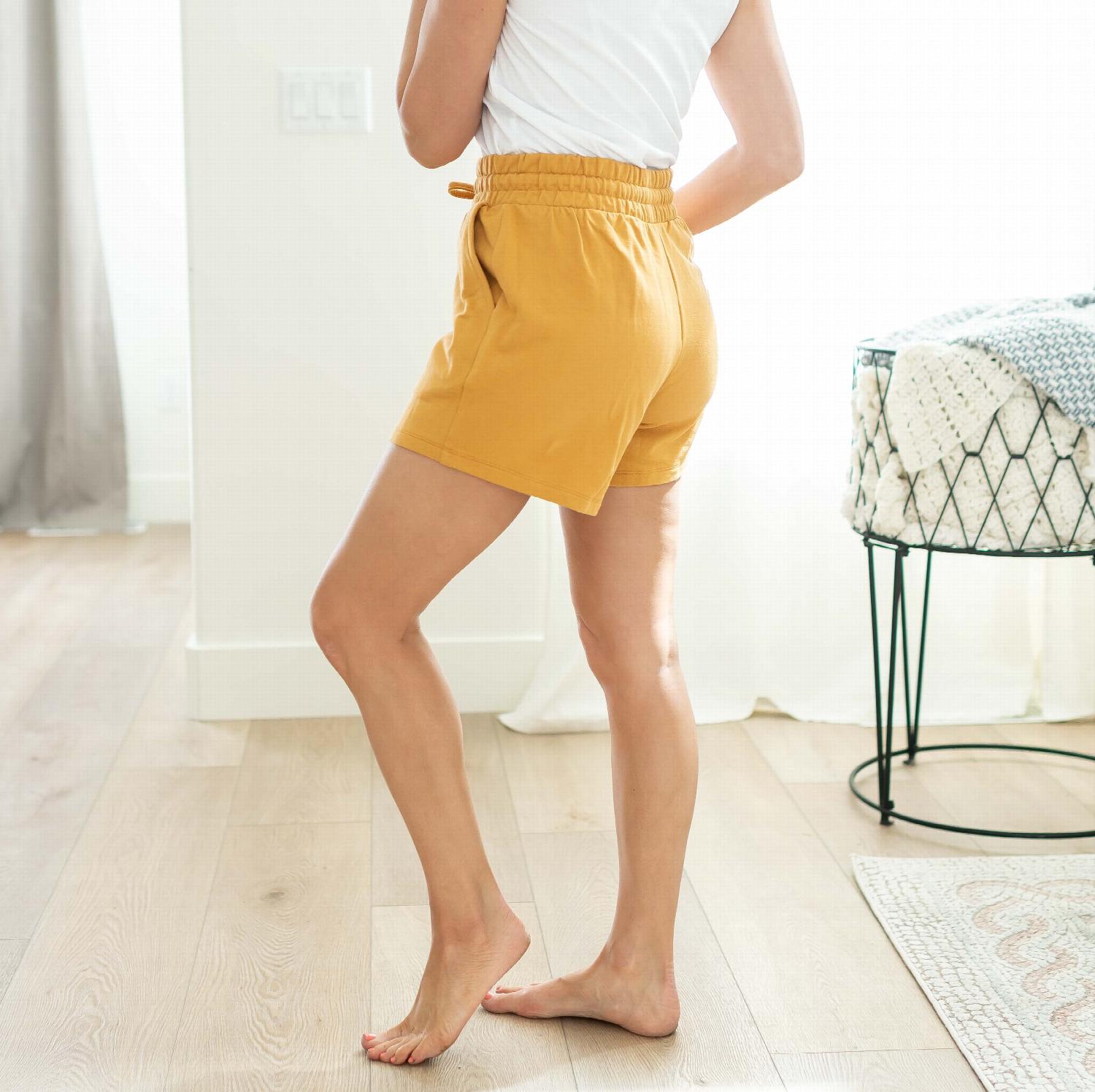 A pair of French Terry Drawstring Waist Shorts in a soft cotton fabric, featuring a roughed drawstring waistband and side pockets.