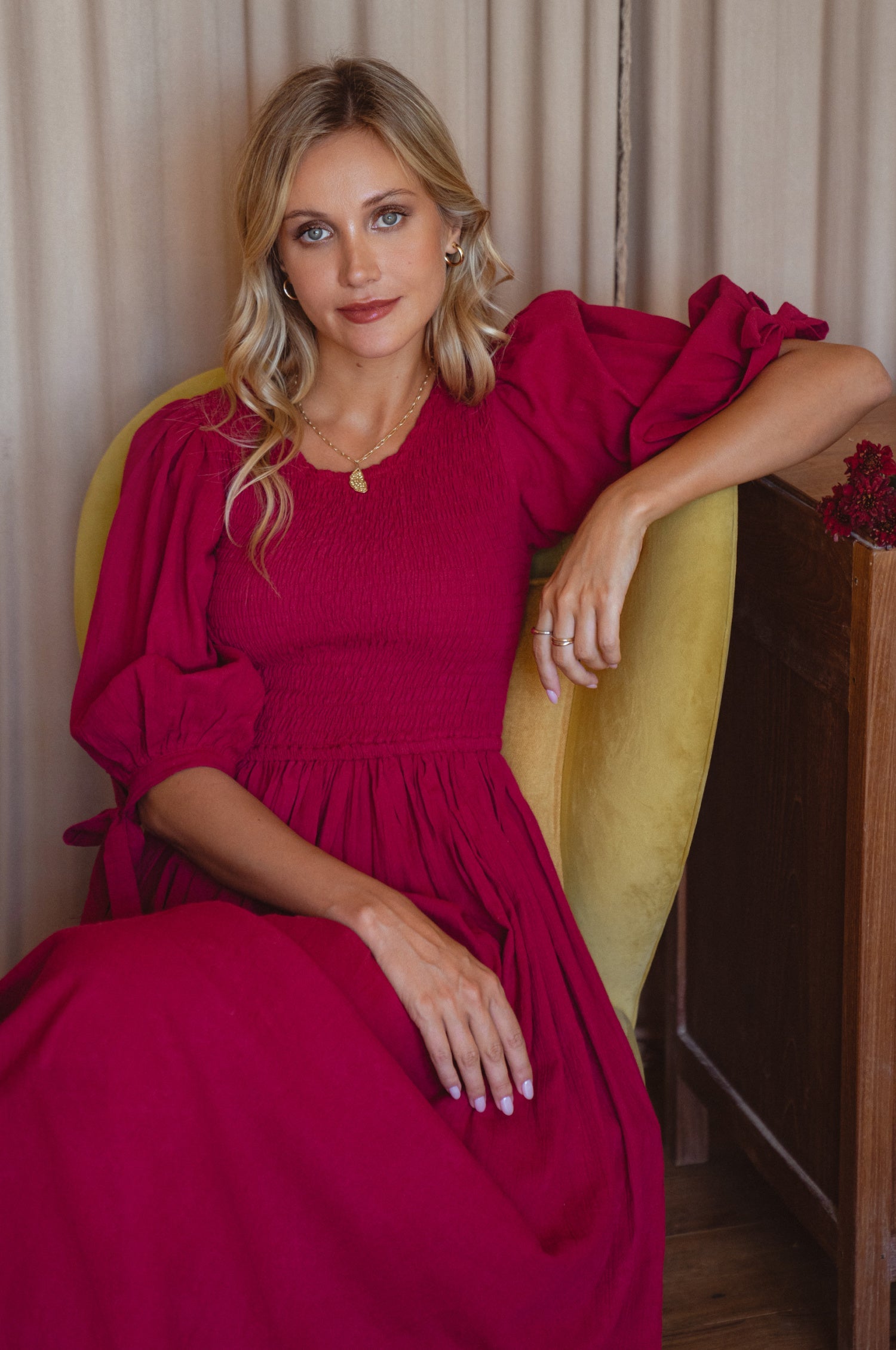 Freya Smocked Linen Midi Dress featuring a smocked bodice and tie-up puffy sleeves, made from high-quality crinkle linen.