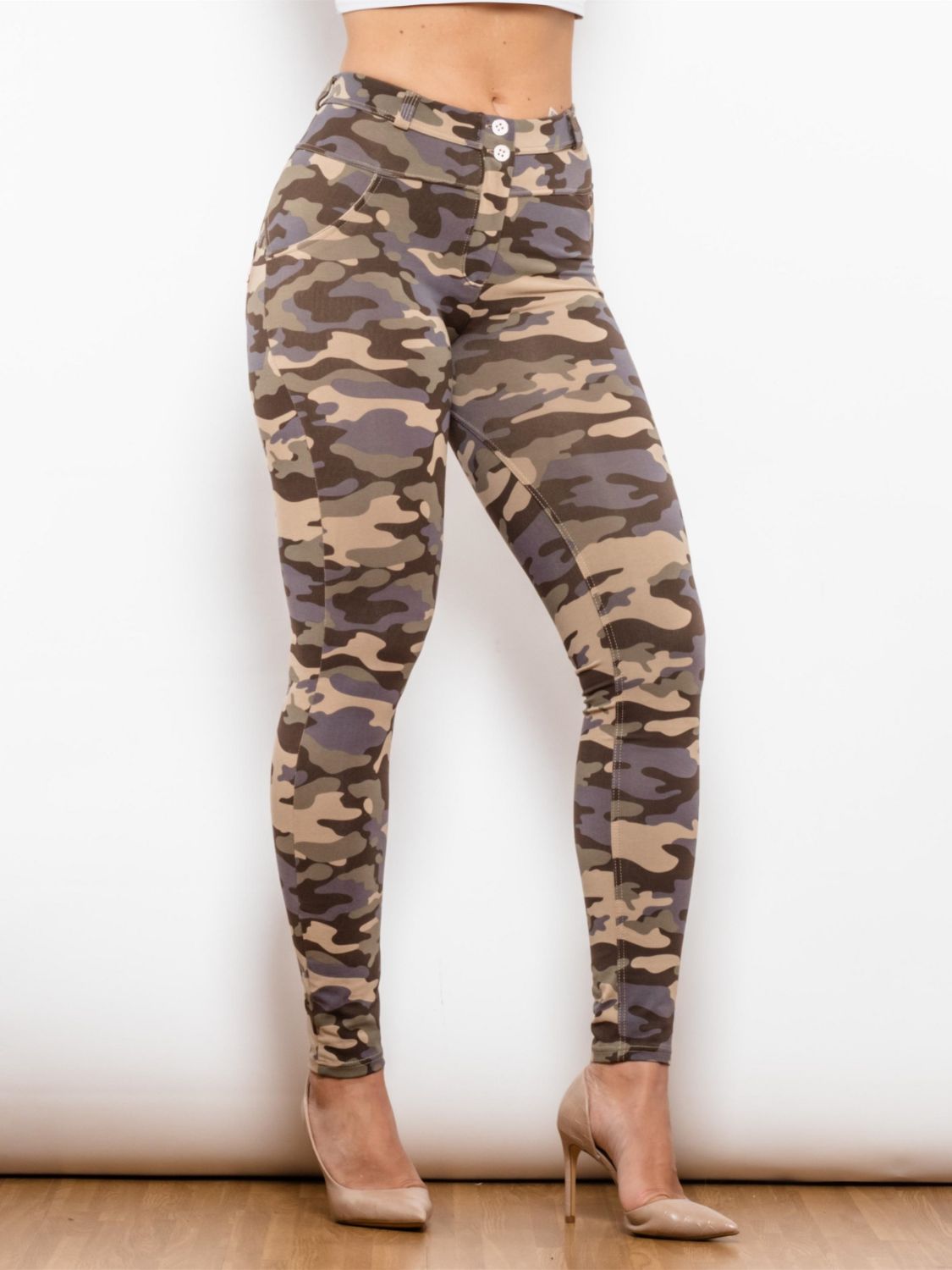 Full Size Camouflage Buttoned Leggings showcasing a stylish camouflage pattern with button details, designed for a slim fit and comfort.