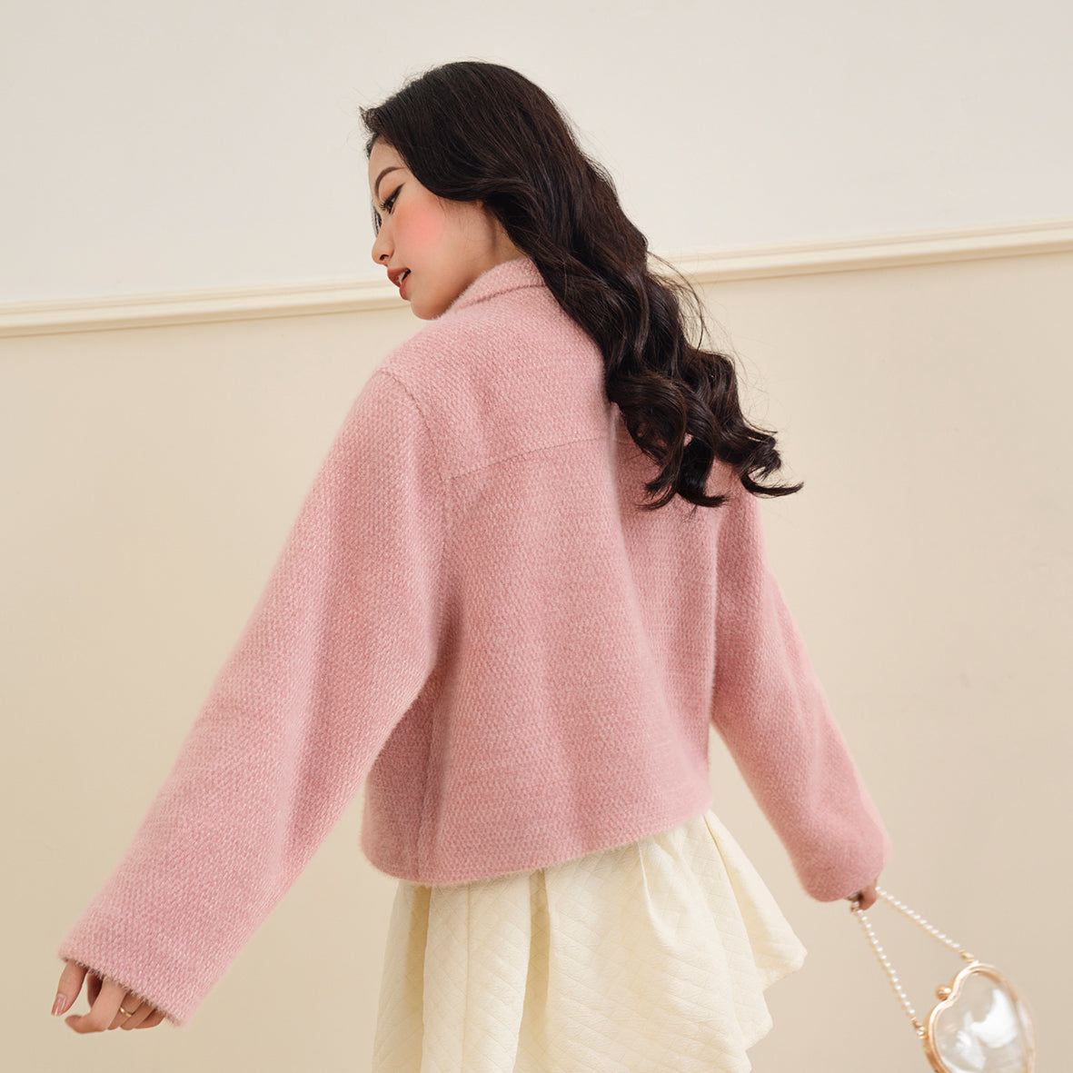 A stylish Fuzzy Coat made from super soft fur, perfect for winter wear, featuring a comfortable loose fit and thick lining.