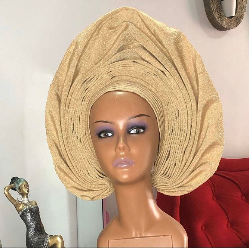 A stylish Gele Hat made from premium asooke fabric, showcasing vibrant colors and elegant design, perfect for various occasions.