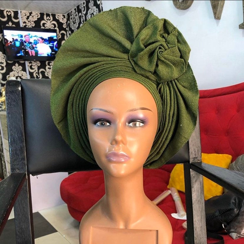 A stylish Gele Hat made from premium asooke fabric, showcasing vibrant colors and elegant design, suitable for all ages.