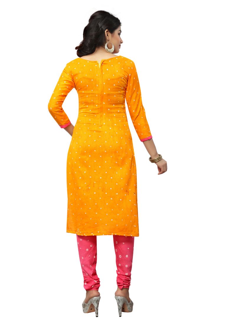 Woman in orange kurta outfit.