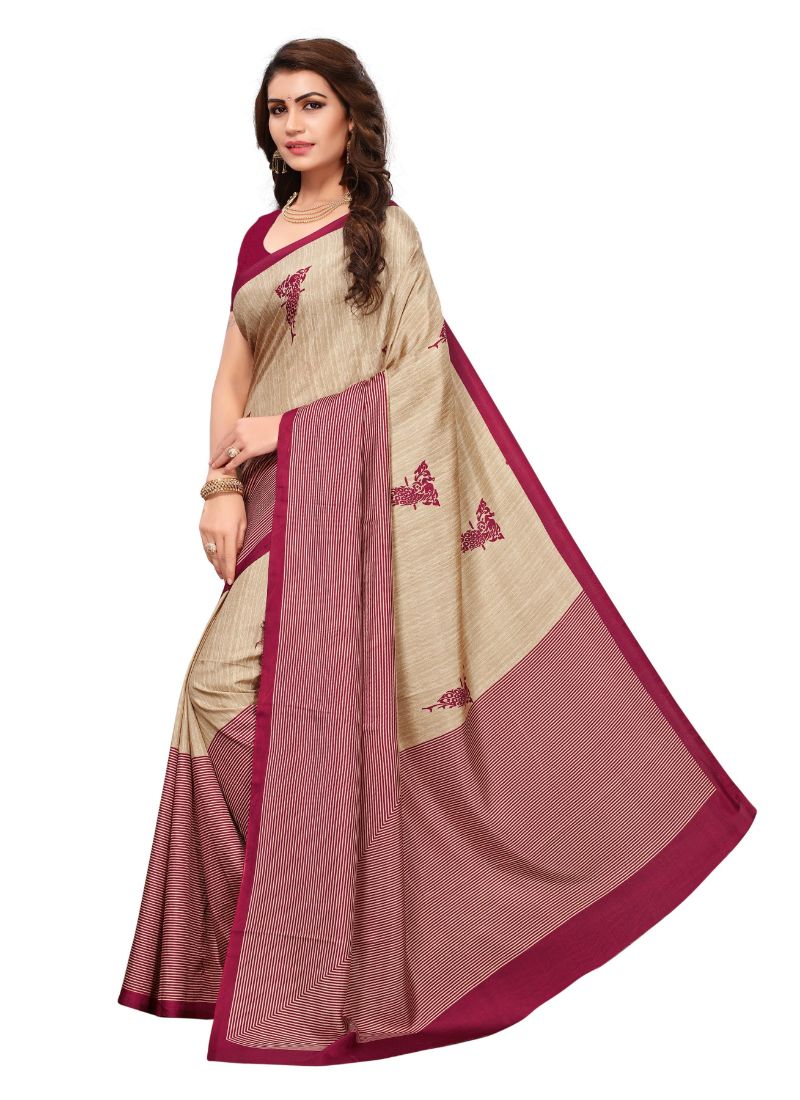 Woman in beige and maroon saree.