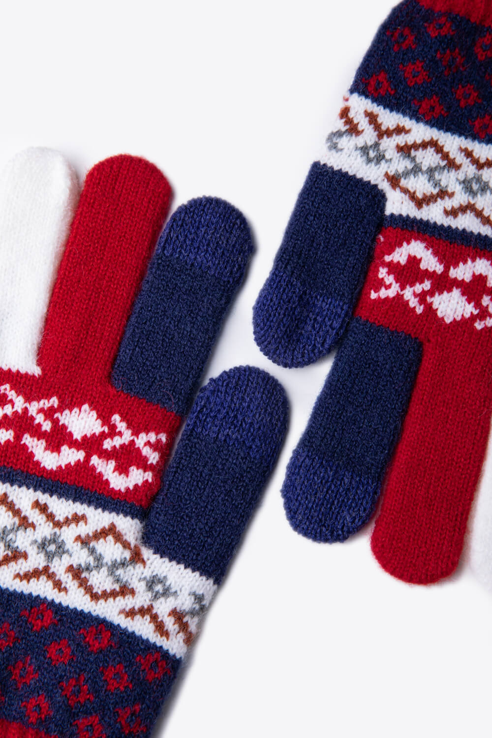 A flat lay of Geometric Five-Finger Knit Gloves showcasing their stylish design and soft acrylic material.