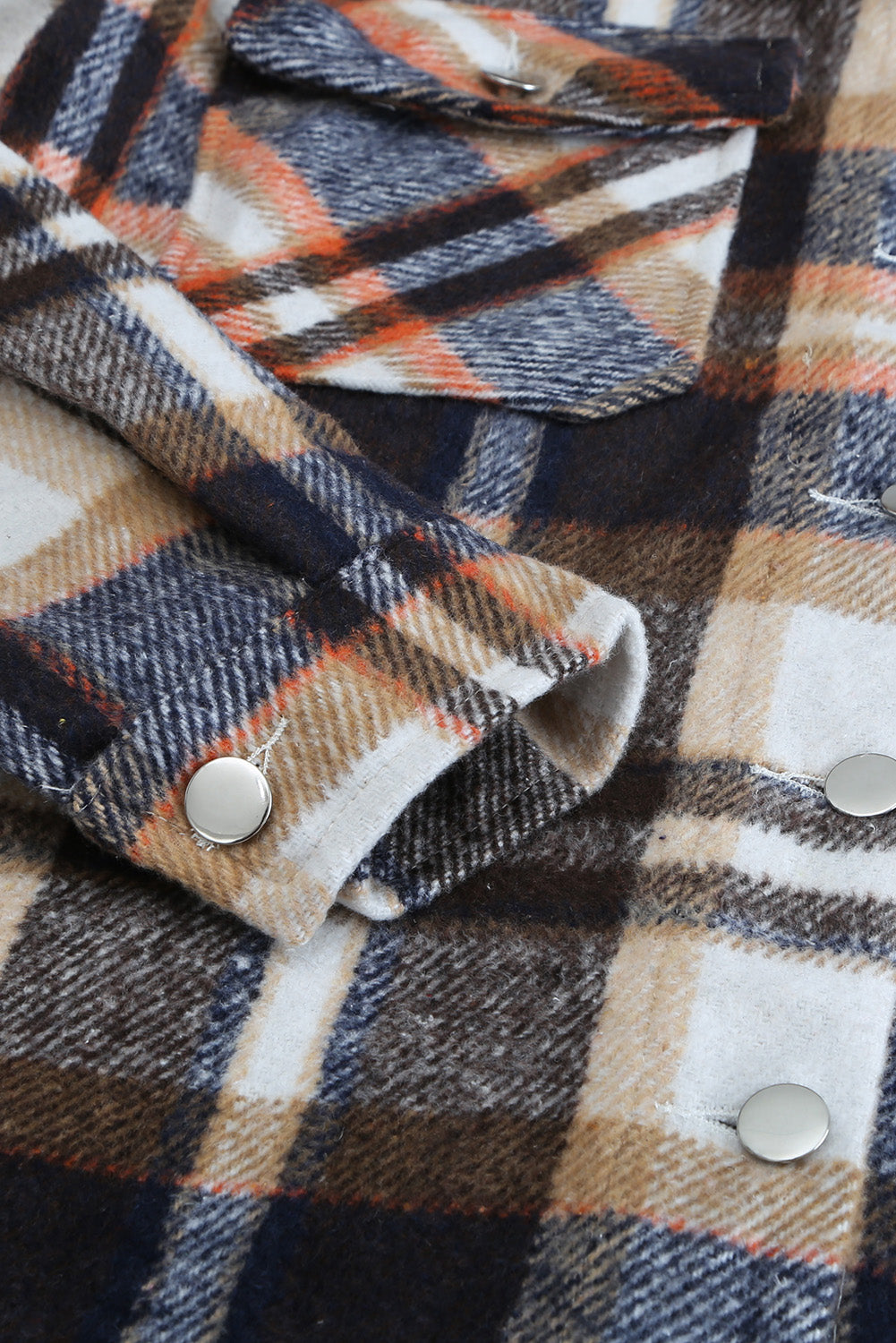 A cozy Geometric Plaid Print Pocketed Shacket featuring a classic plaid pattern, button front, and large pockets, perfect for chilly weather.