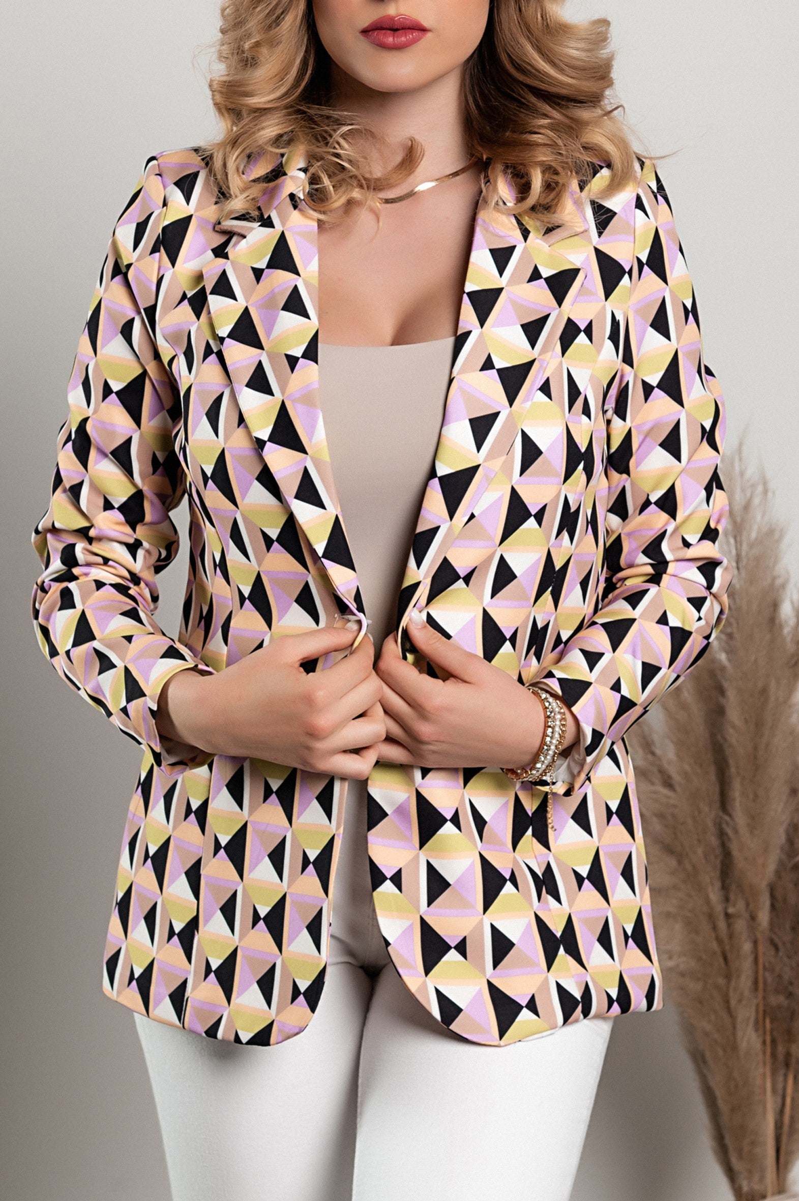 Lilac geometric print blazer featuring a classic collar, padded shoulders, and faux pockets, designed for a stylish look.