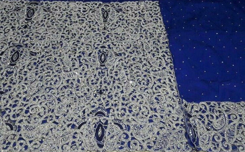 Blue lace fabric with embroidery.