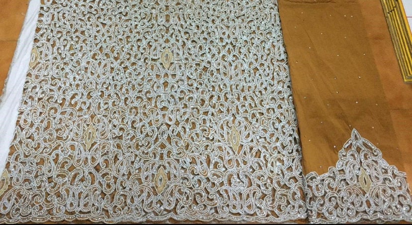 Intricate lace fabric on display.