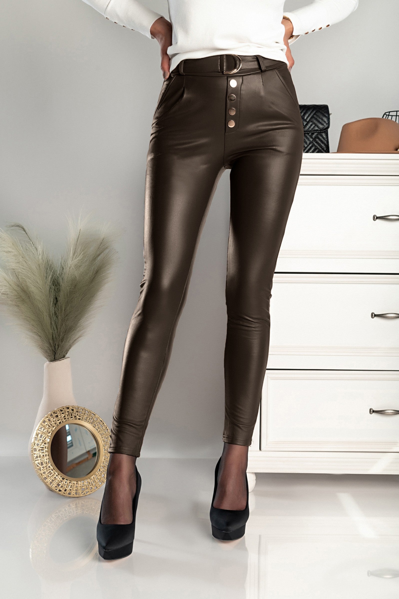 Gilley faux leather skinny pants in brown with decorative buttons and side pockets.